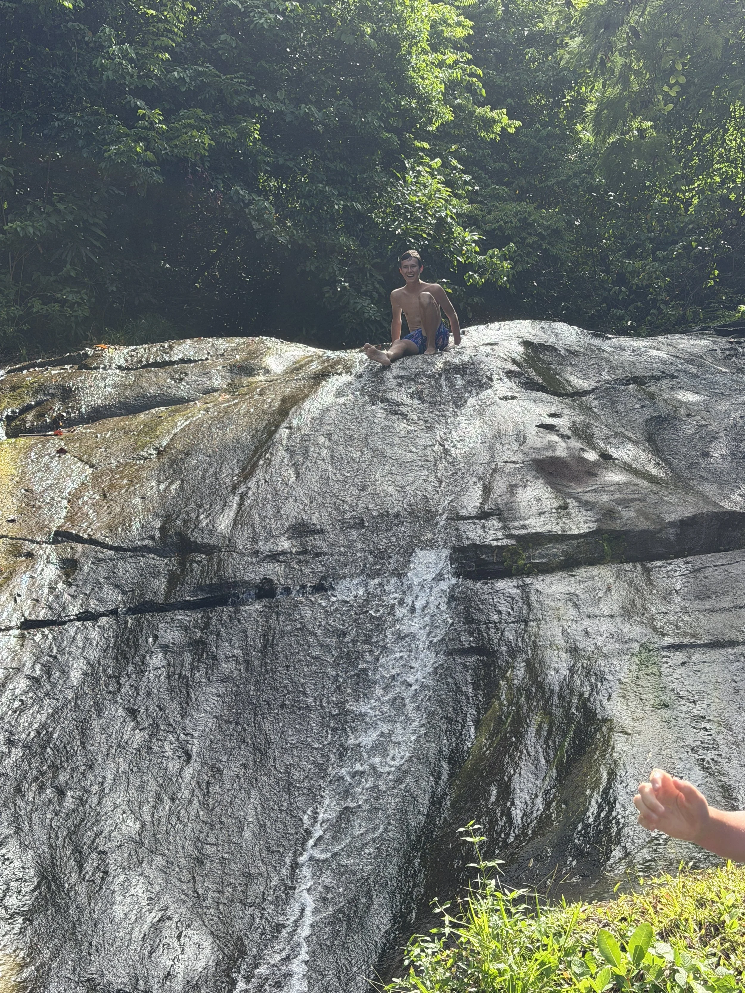 Henry sliding down the lower falls