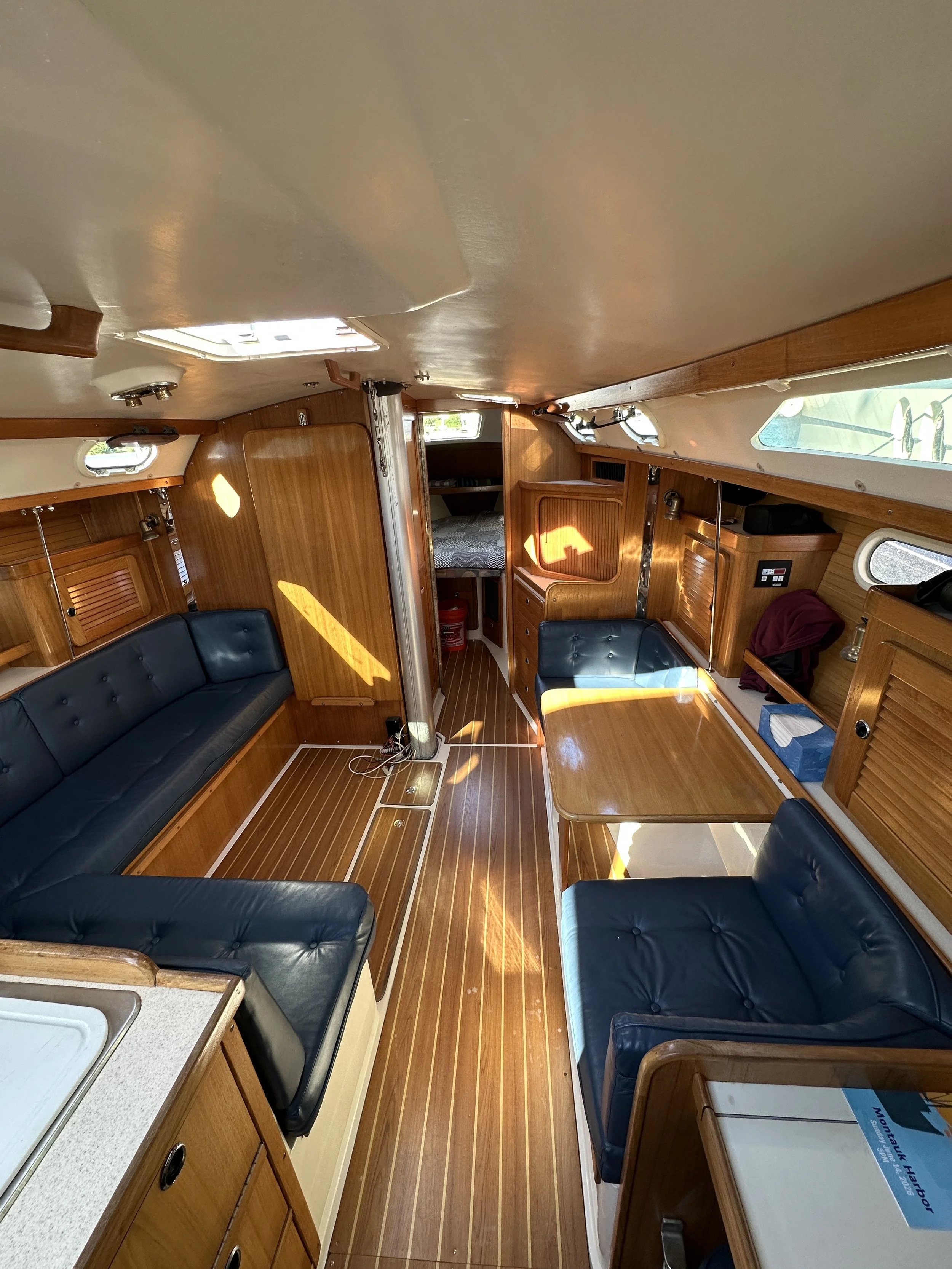 Bright interior saloon and private head on Barbara Bell Catalina 36 MkII for comfortable Montauk charters