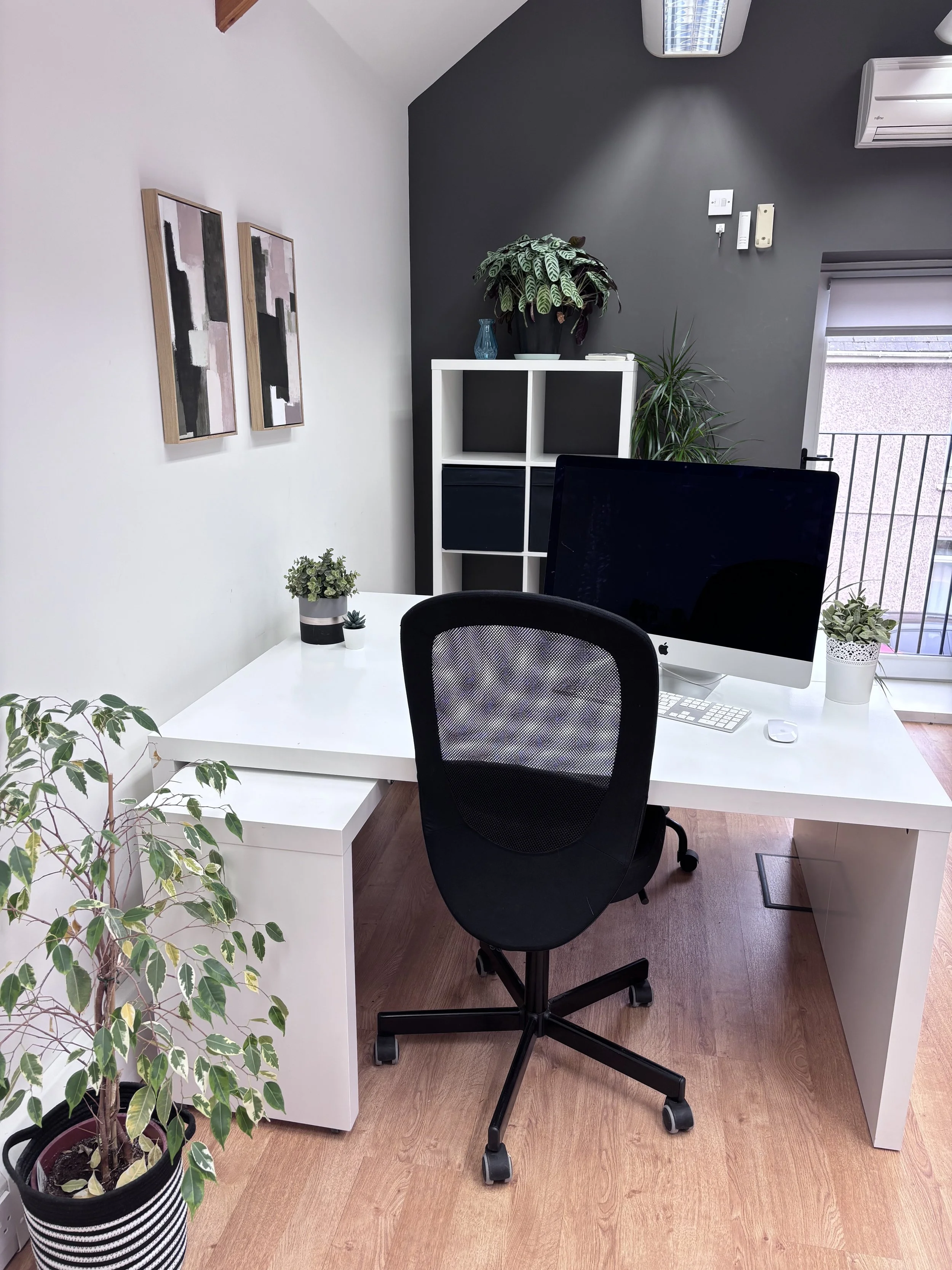 Two white desks, available for Members of The Coach House workspace