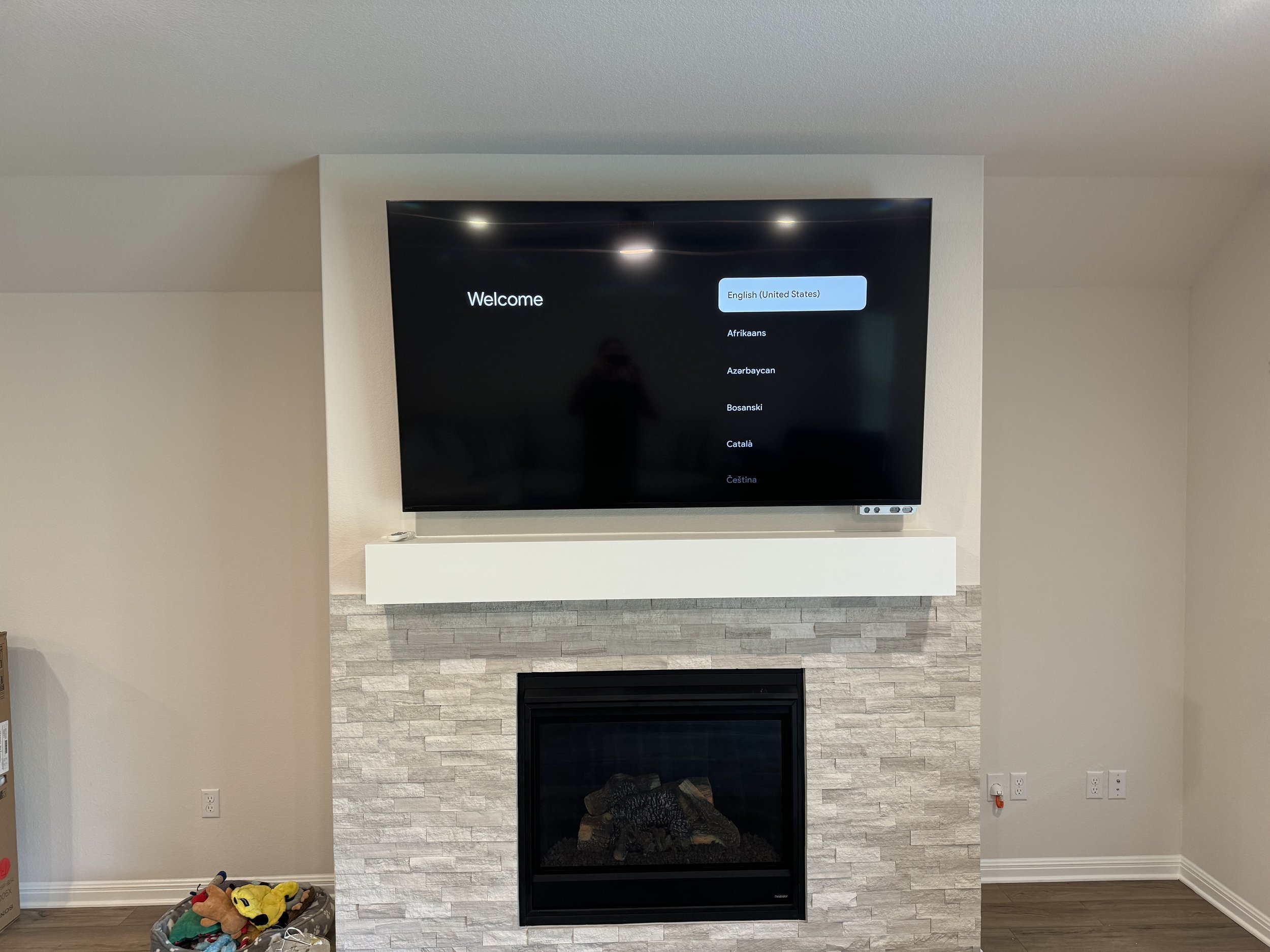 TV mounted above fireplace in North Austin