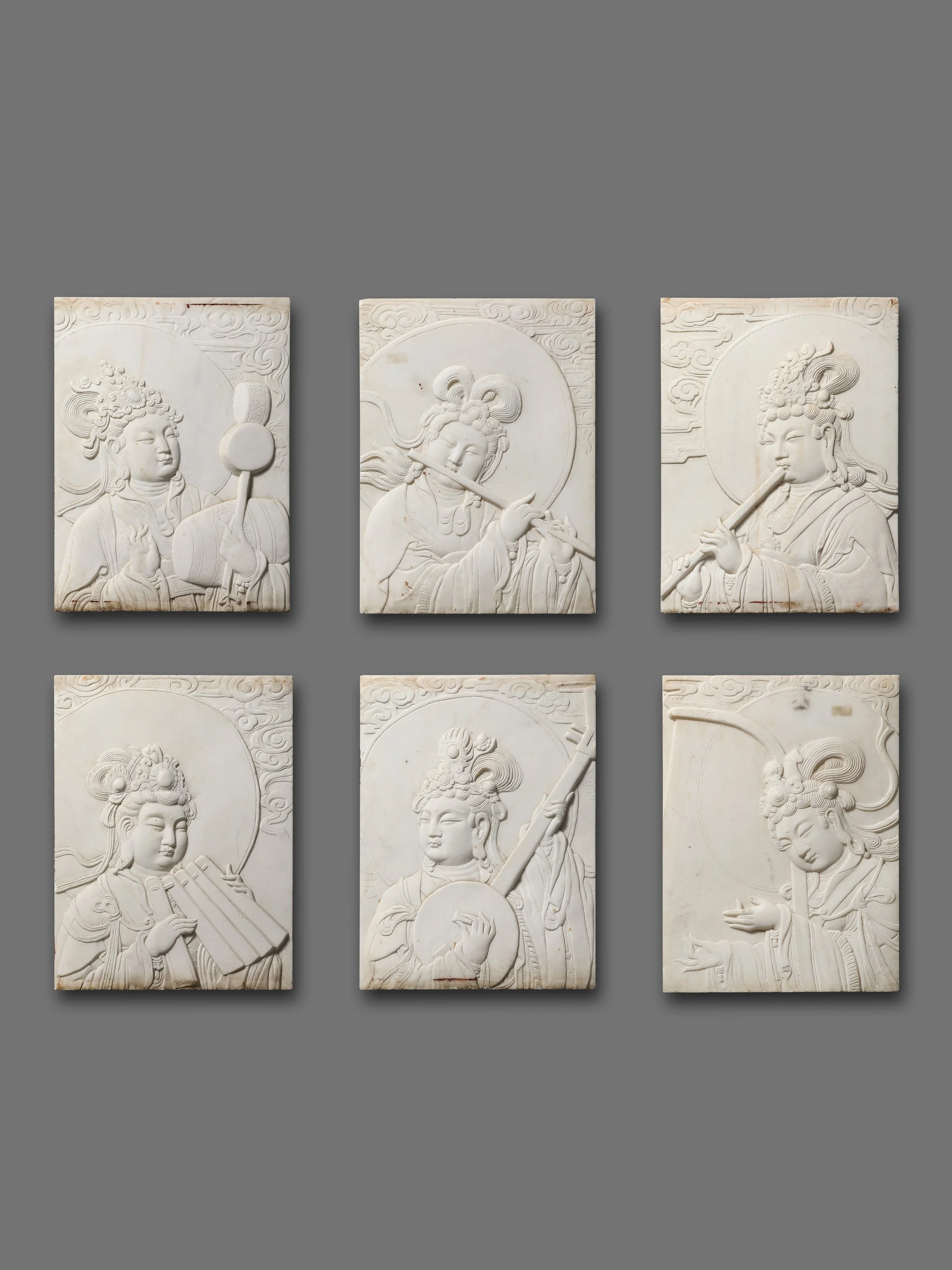 A Set of Six Carved White Marble Relief Panels Depicting Celestial Musicians in the Tang Taste