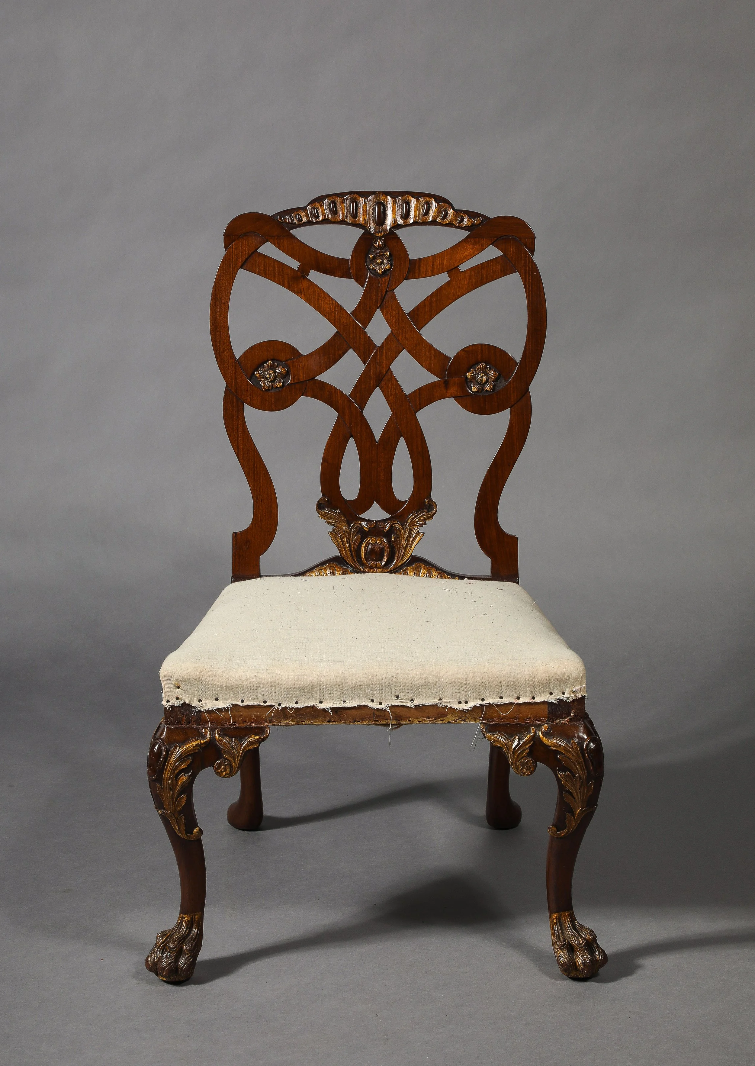 A set of 14 Antique Mahogany and Partially Gilt Chairs after a design of Matthew Darly