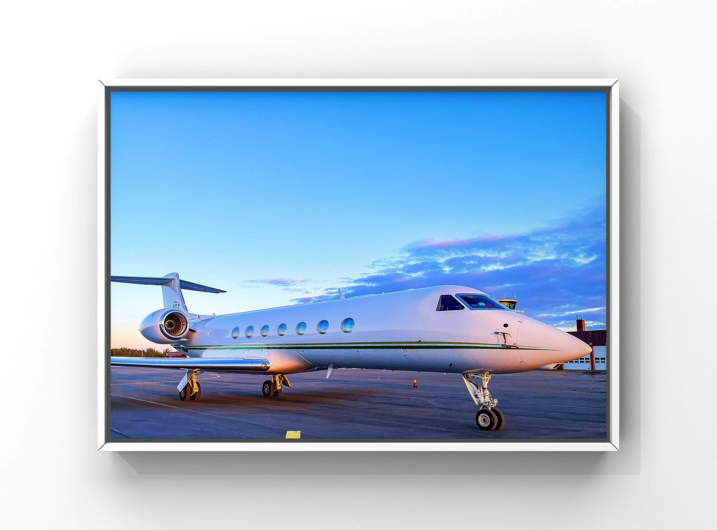Professional aircraft exterior detailing with polished private jet under blue sky in Raleigh-Durham area