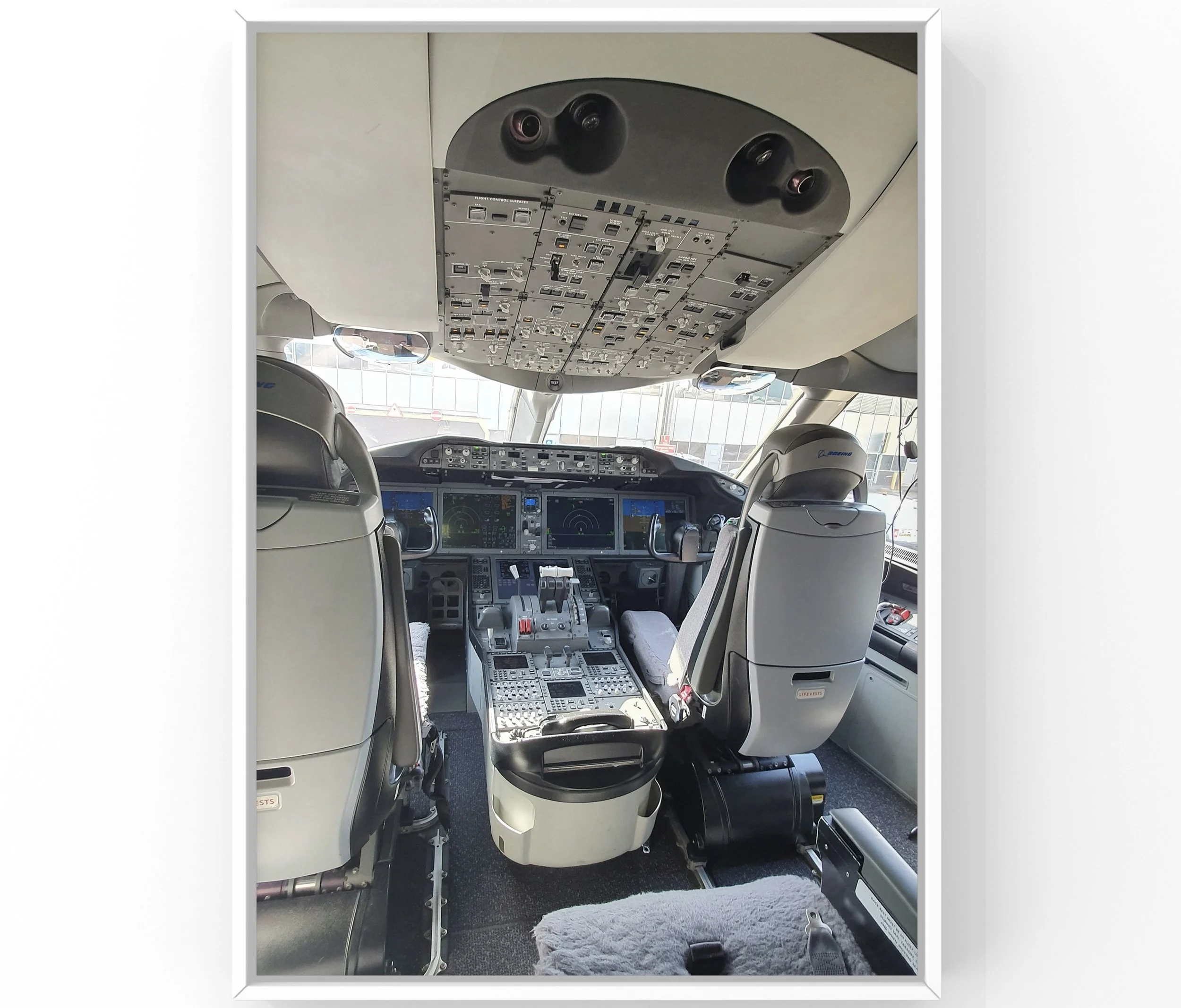 Aircraft cockpit interior detailing with cleaned panels and pilot seating in Raleigh-Durham RDU