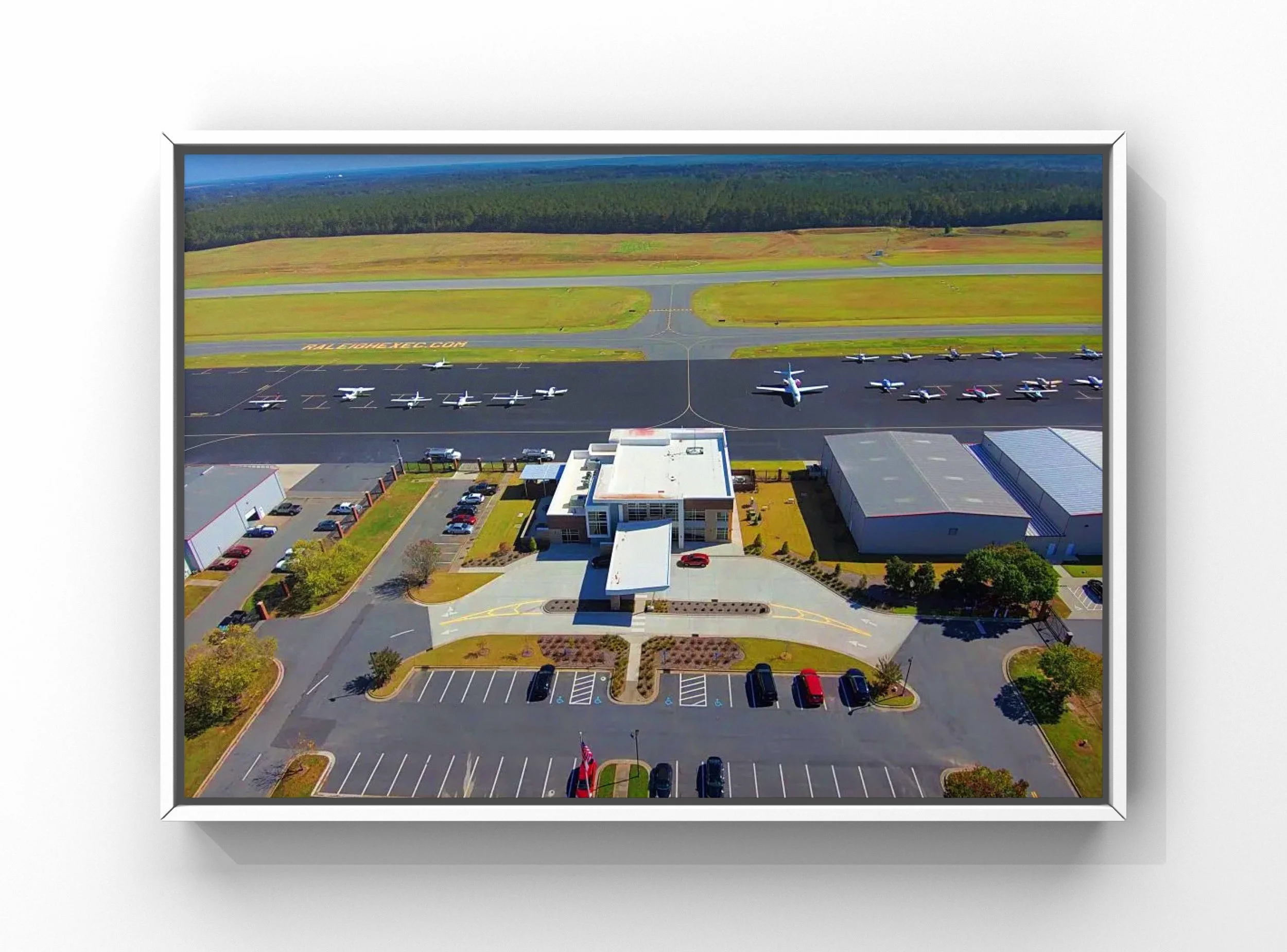 Exterior aircraft detailing at Raleigh Executive Jetport (TTA) showing hangars, ramp, and runway in North Carolina