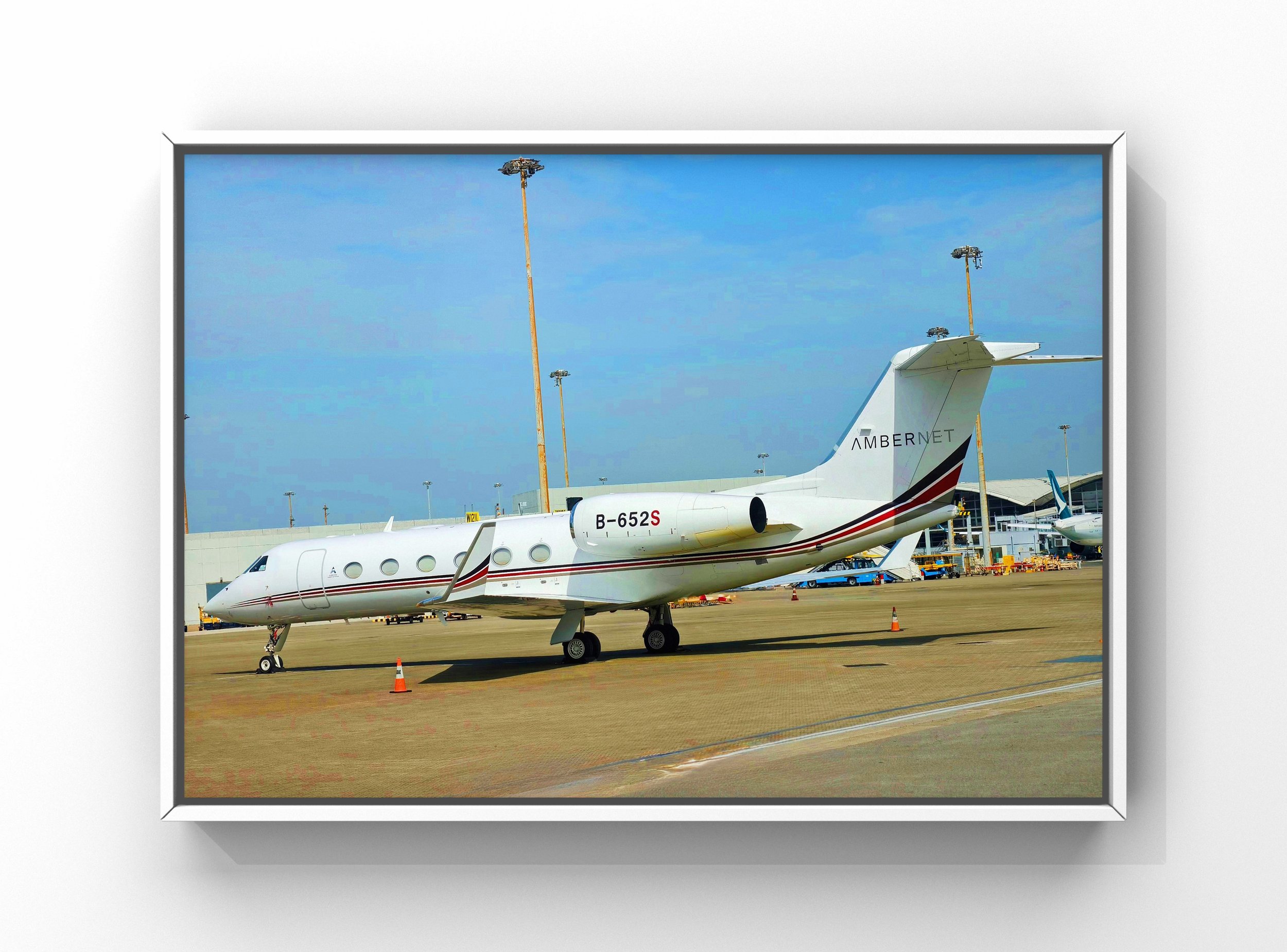 Private jet exterior detailing showing clean fuselage and wings on airport tarmac in Raleigh NC