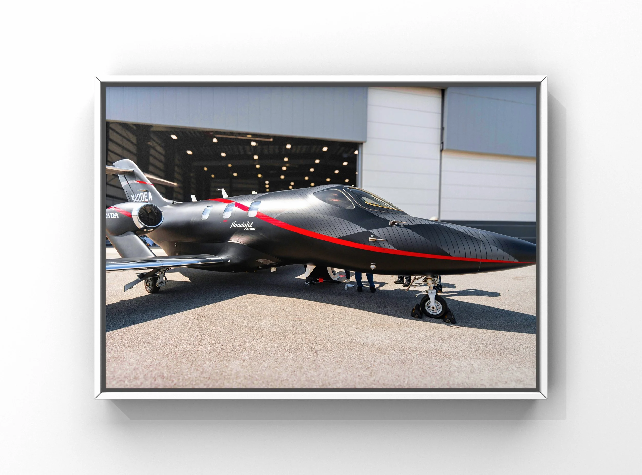 Aircraft exterior detailing service with clean fuselage and wings on private jet at airport in Raleigh NC