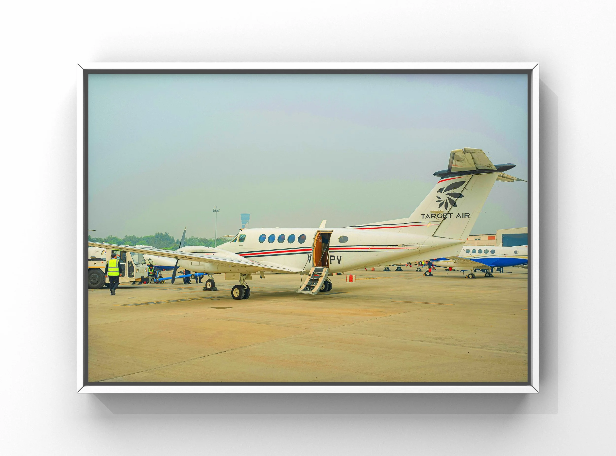 Aircraft exterior cleaning service with polished private jet on airport ramp at RDU