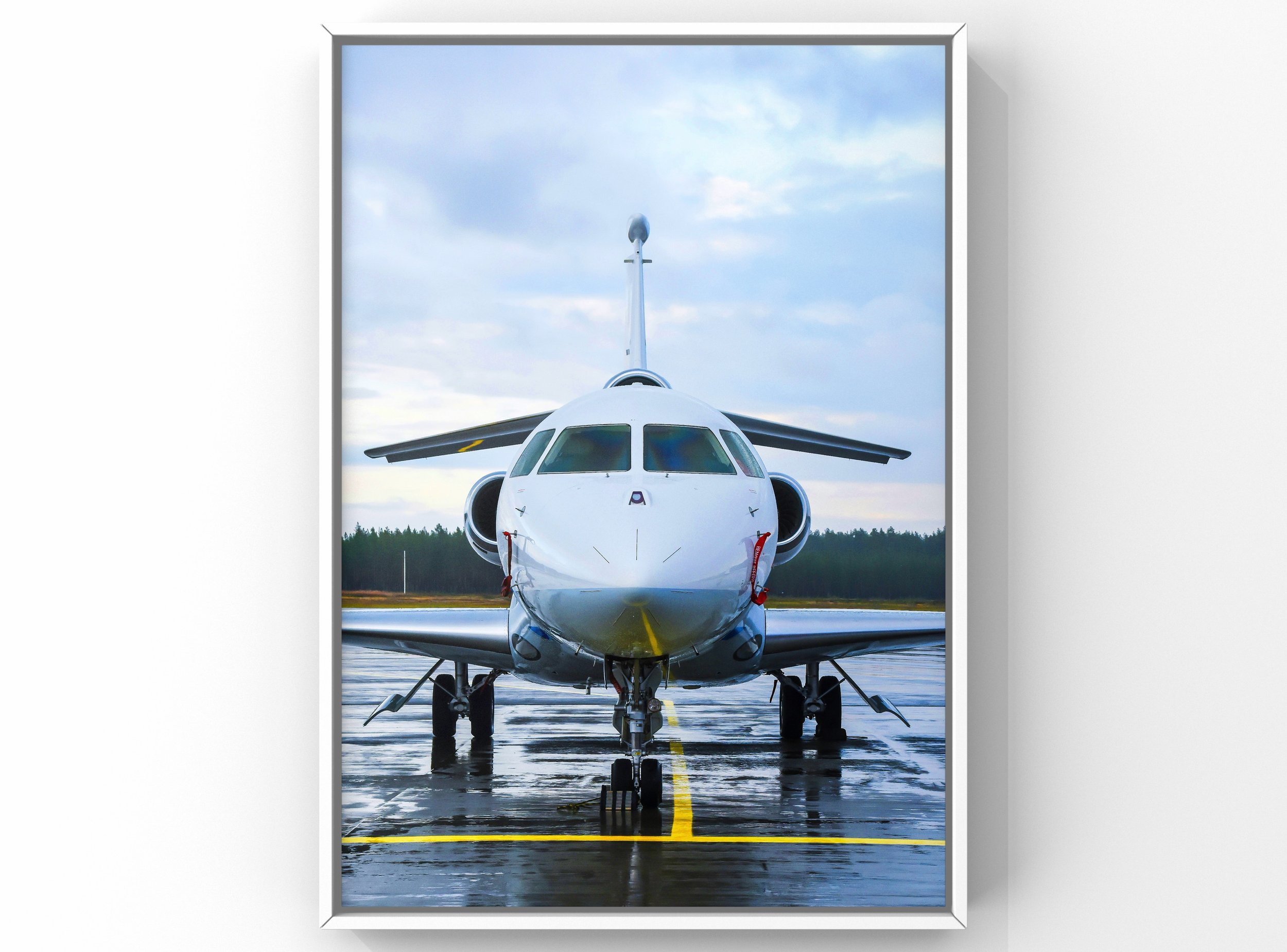 Private jet exterior cleaning showing polished aircraft front view on wet runway in Raleigh NC