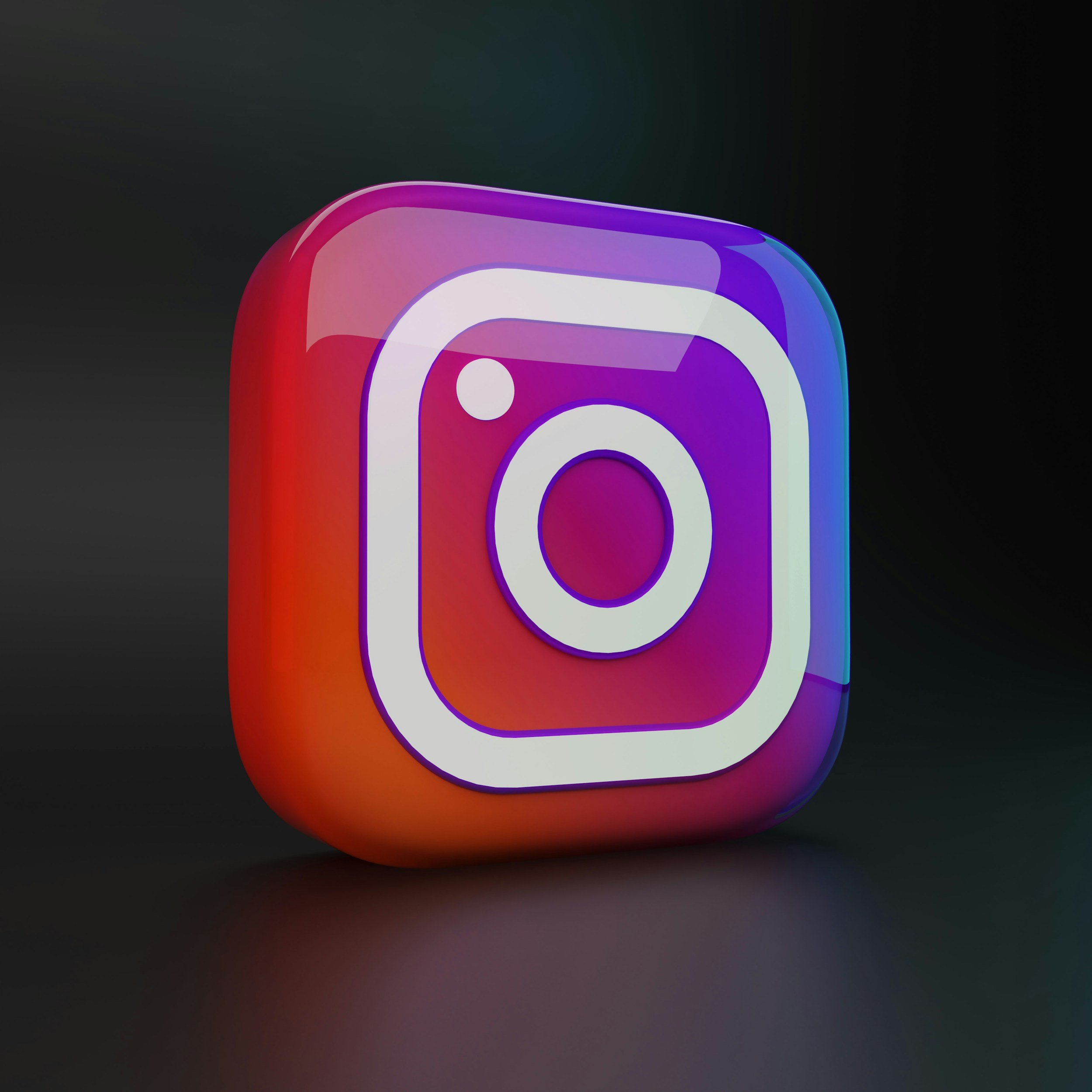 3D glowing Instagram logo icon with a black background.