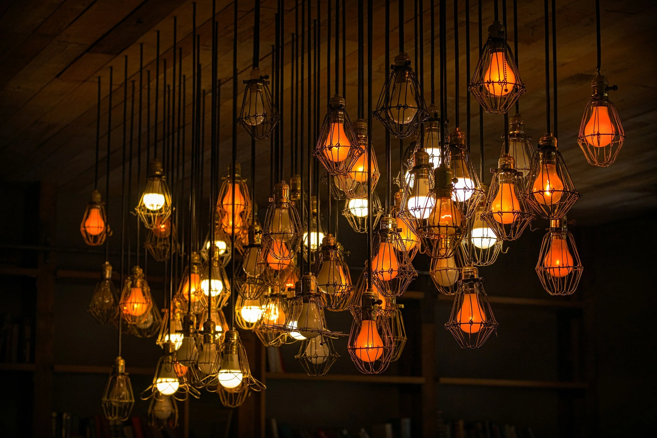 Graphic of hanging light fixtures representing decorative lighting installation in North Idaho