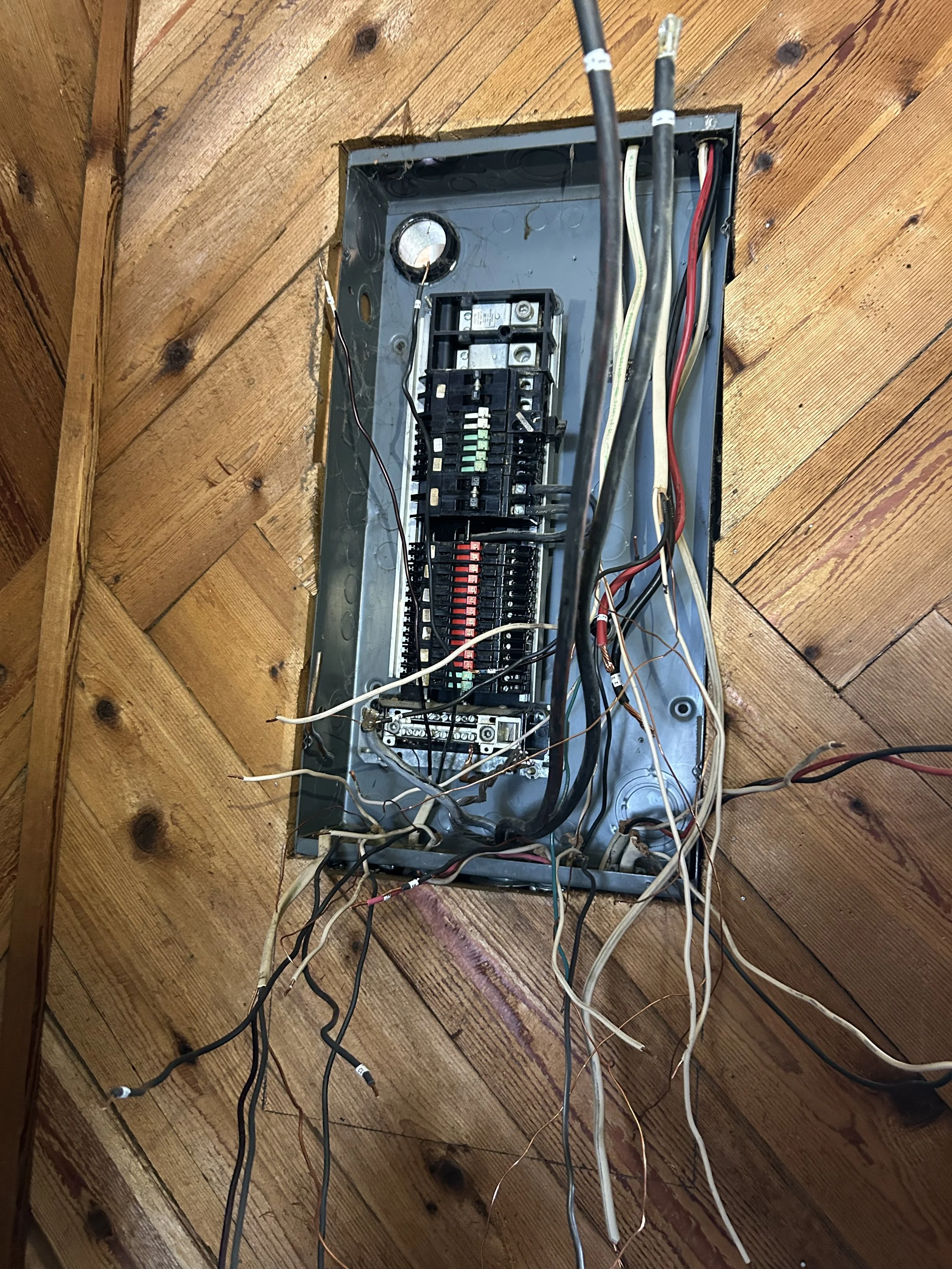 Old electrical panel before upgrade in Bayview Idaho home