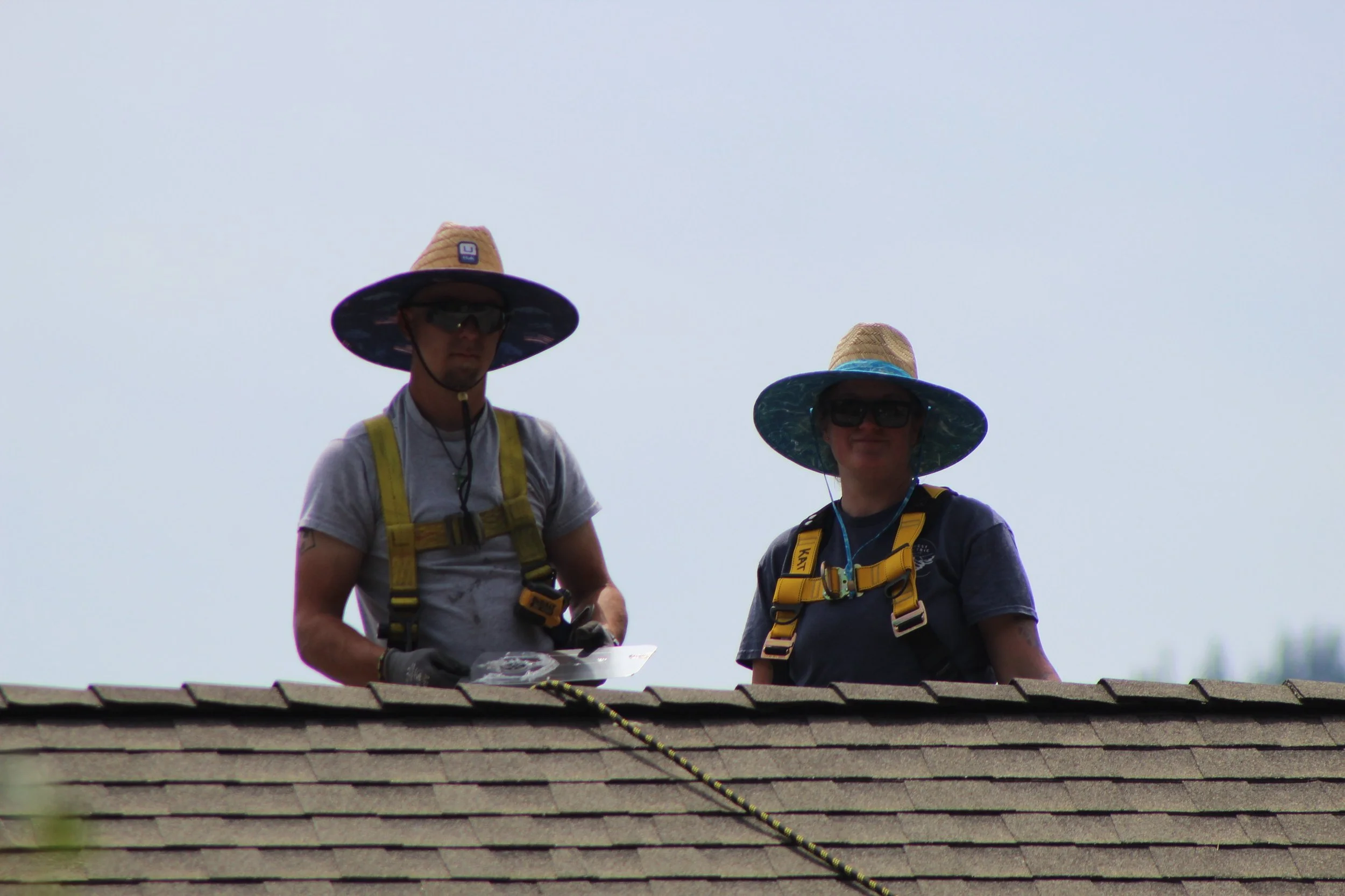 Honest Electric team installing solar panels on a roof in North Idaho