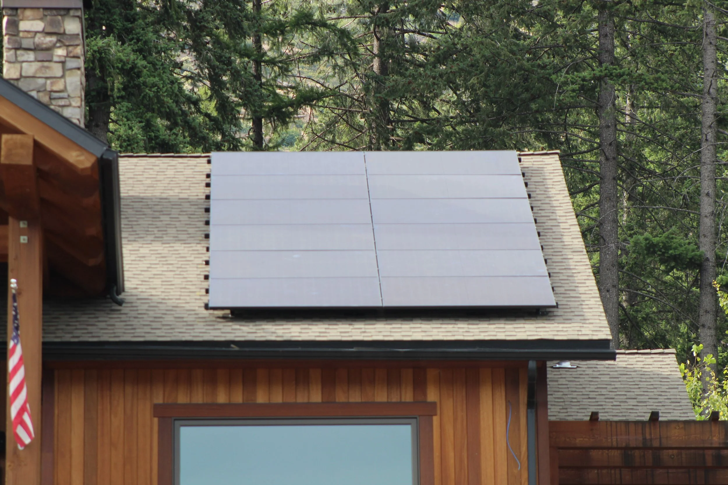 Roof-mounted solar panel installation on a home in Bayview, Idaho