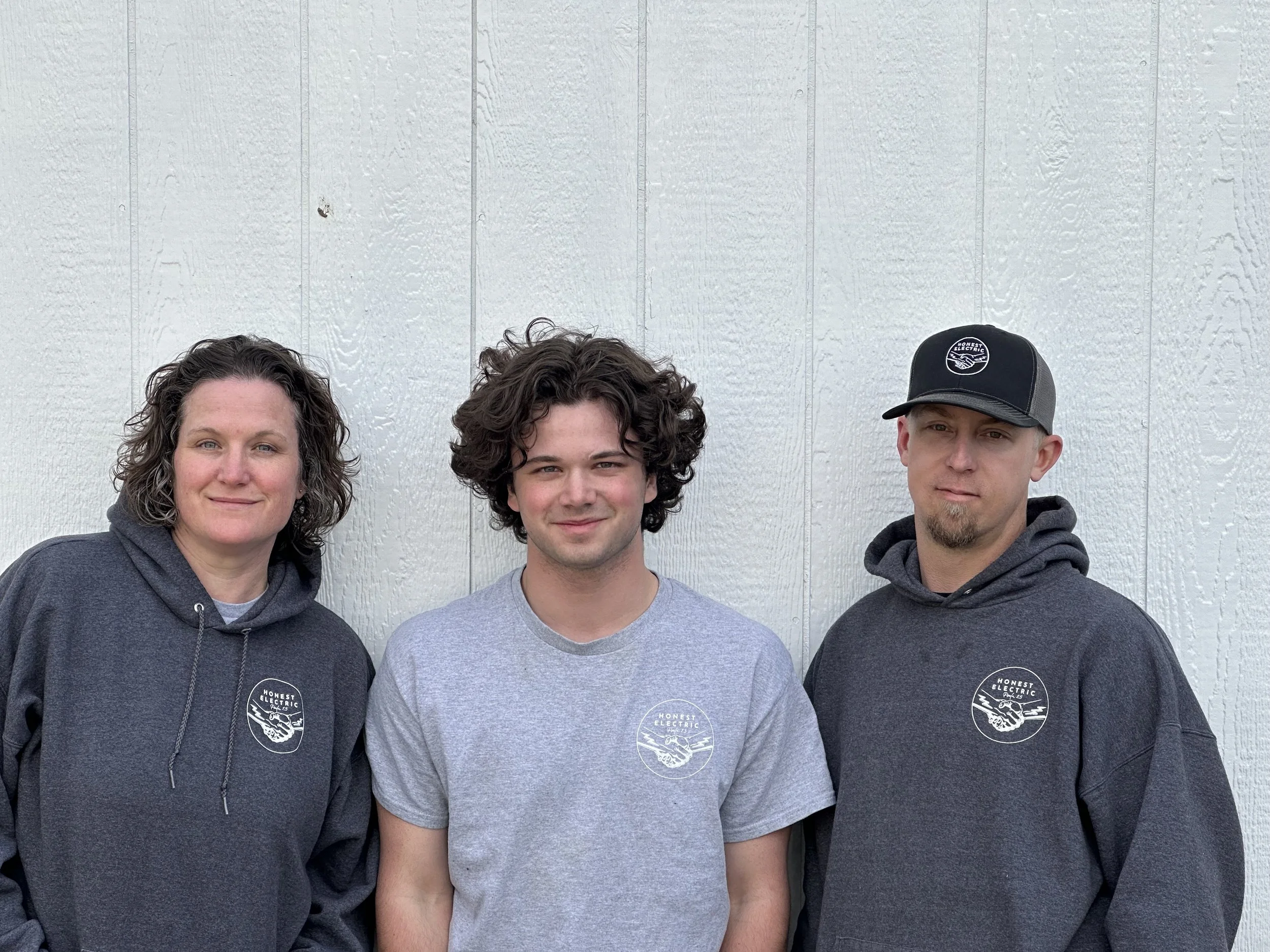 Family photo of the Honest Electric team in North Idaho