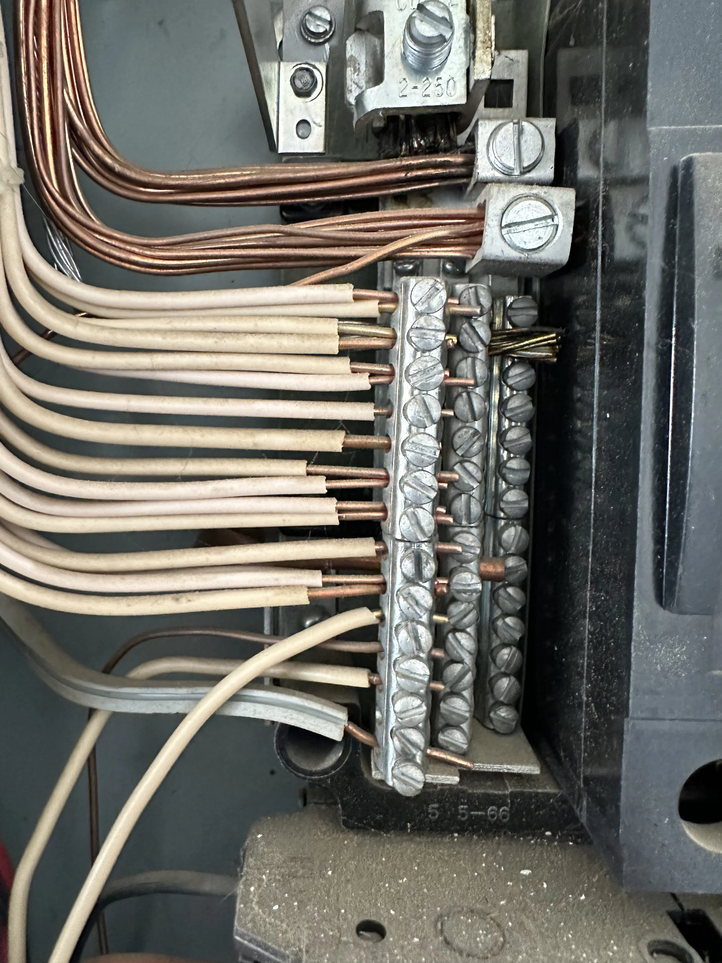 Double tapped neutral wires in electrical panel showing improper wiring in North Idaho home