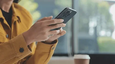 Person holding a smartphone in hand.