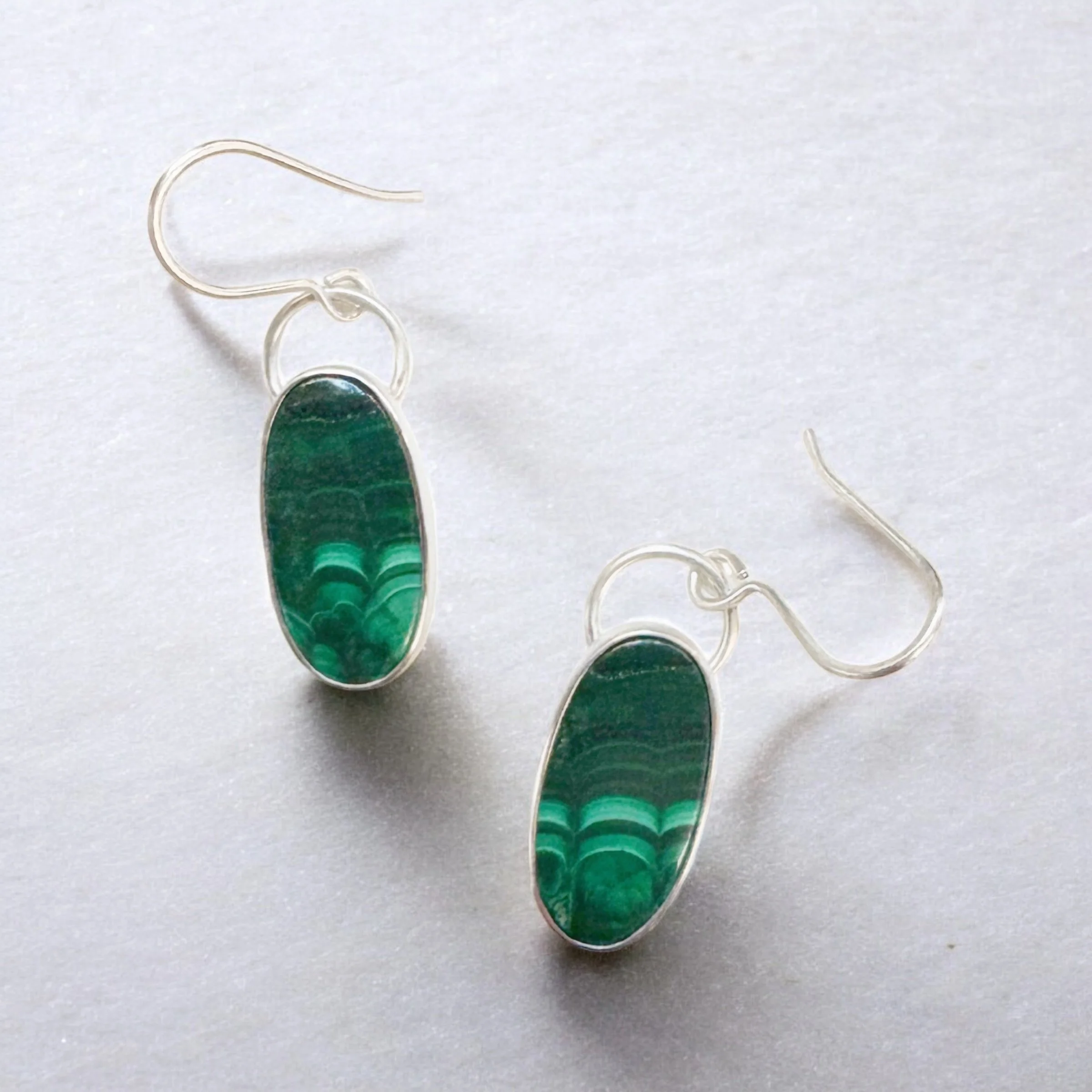 Malachite drop earrings in sterling silver bezels.