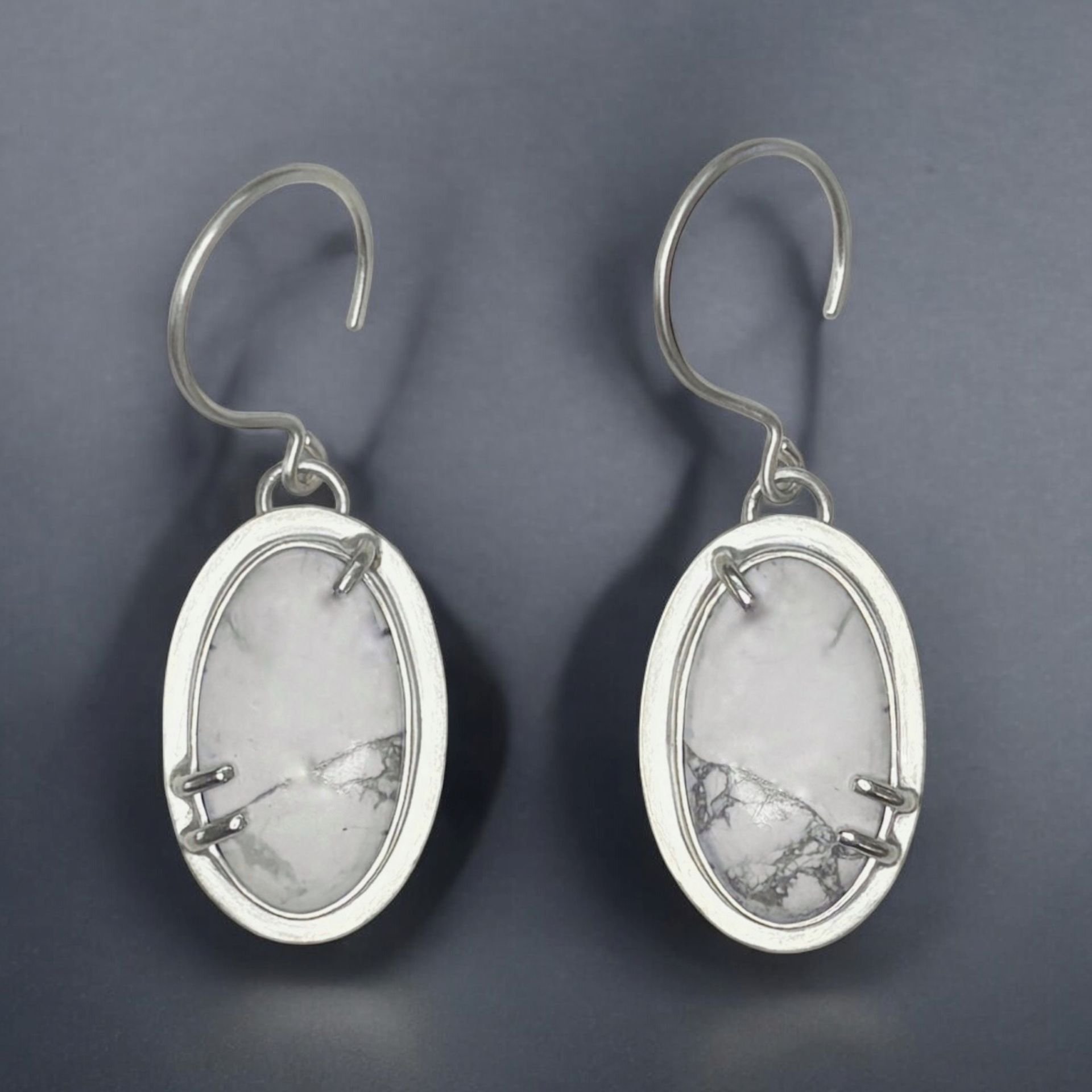 Howlite drop earrings in sterling silver bezel and prong settings.