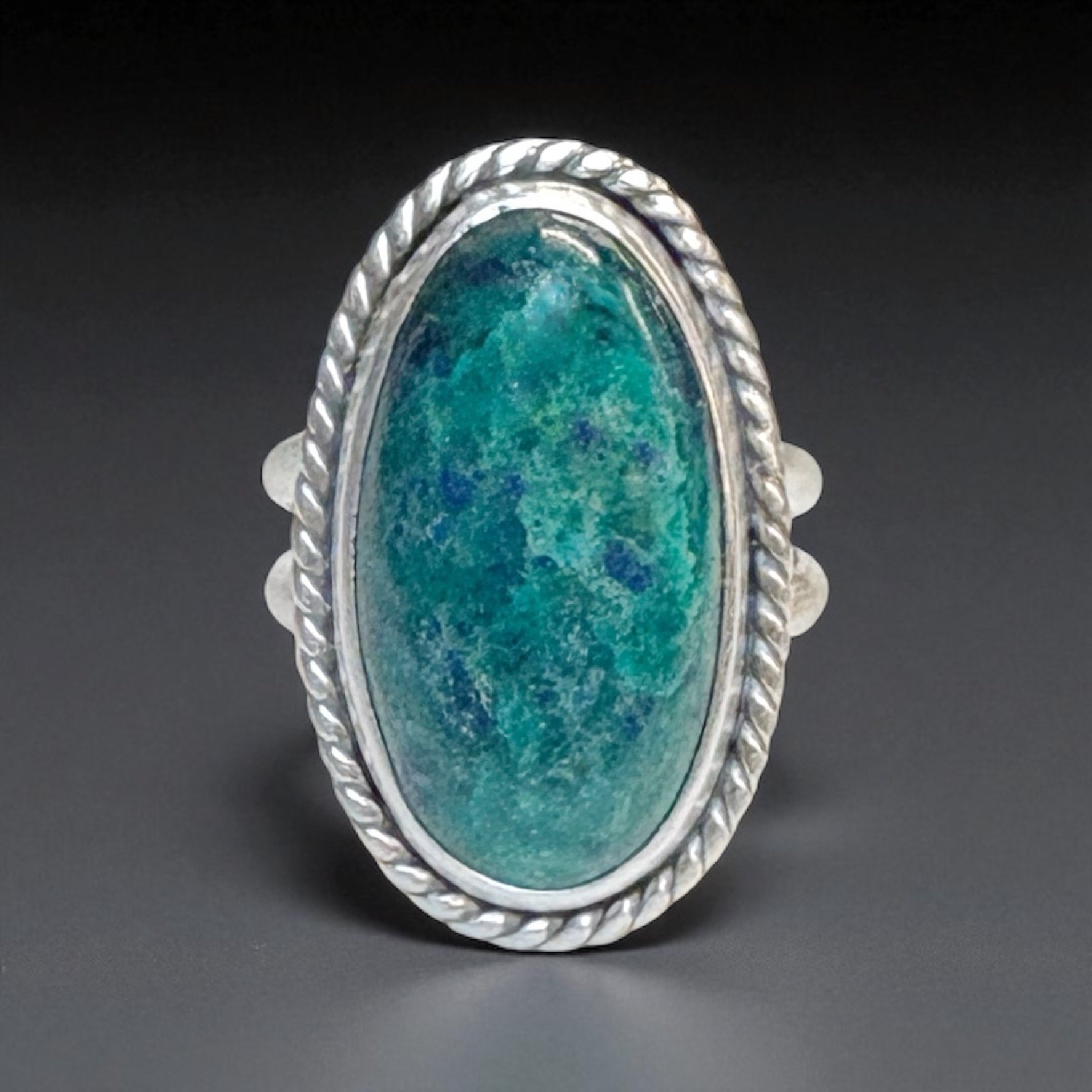 Chrysocolla azurite in a sterling silver ring with a rope‑style bezel accent.