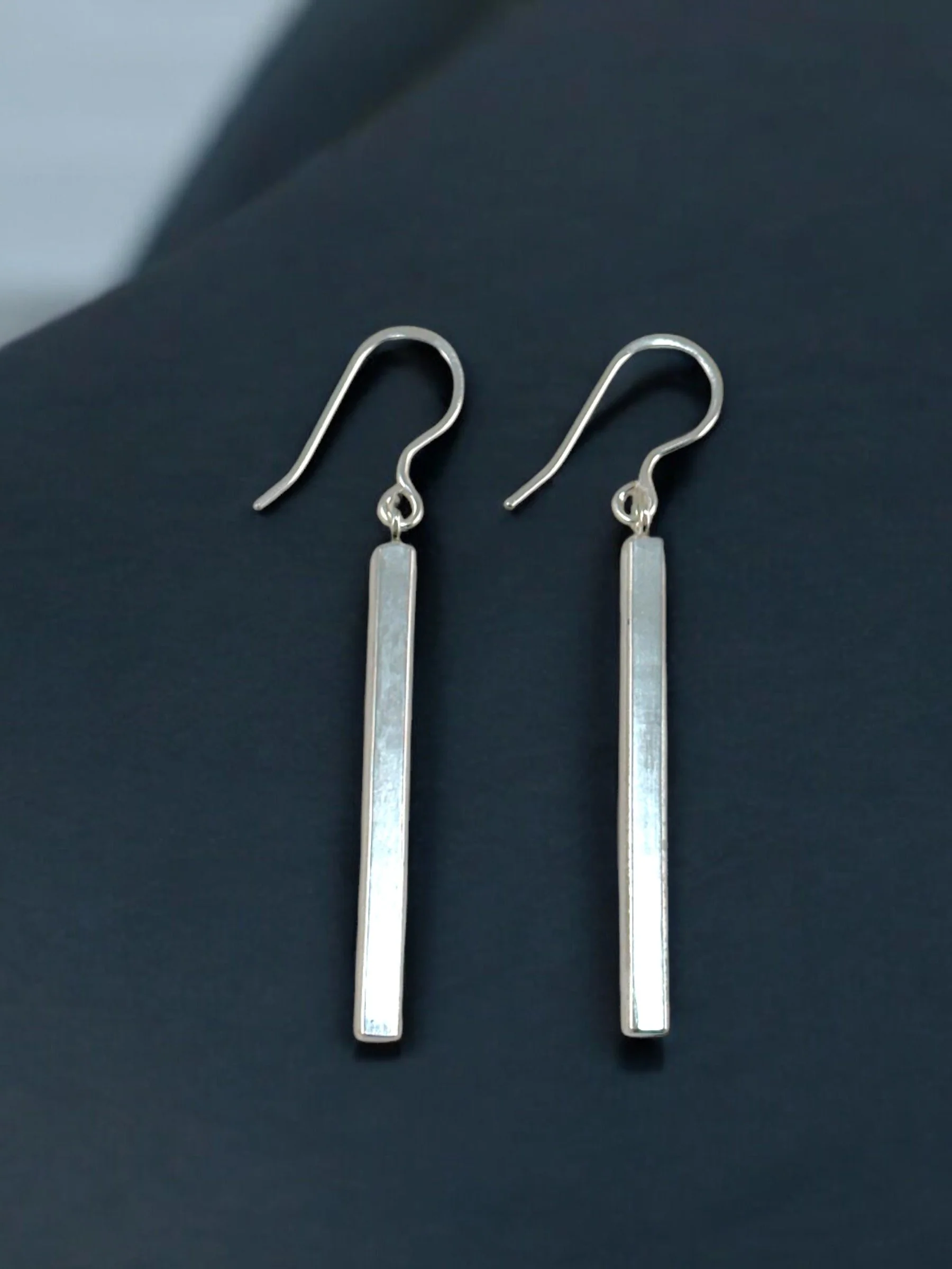 Sterling silver bar earrings in a polished finish.
