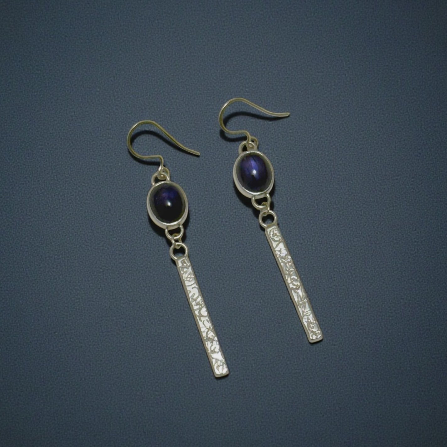 Iolite drop earrings in sterling silver with patterned bars.