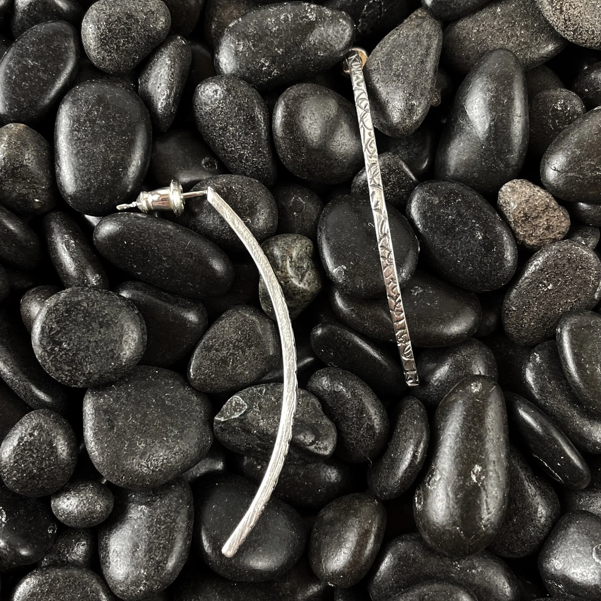 Textured sterling silver post earrings.