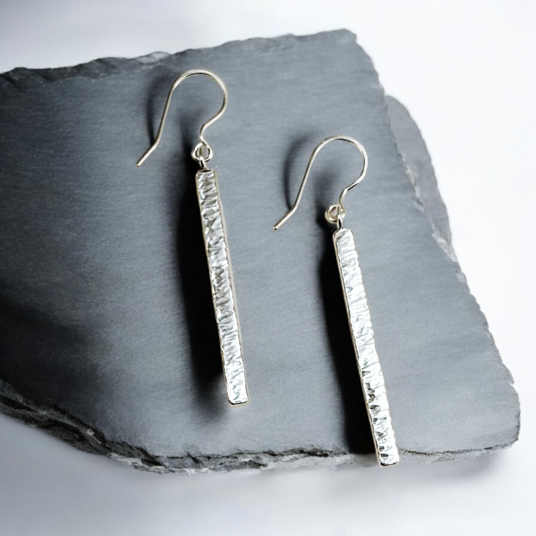 Textured sterling silver drop earrings.
