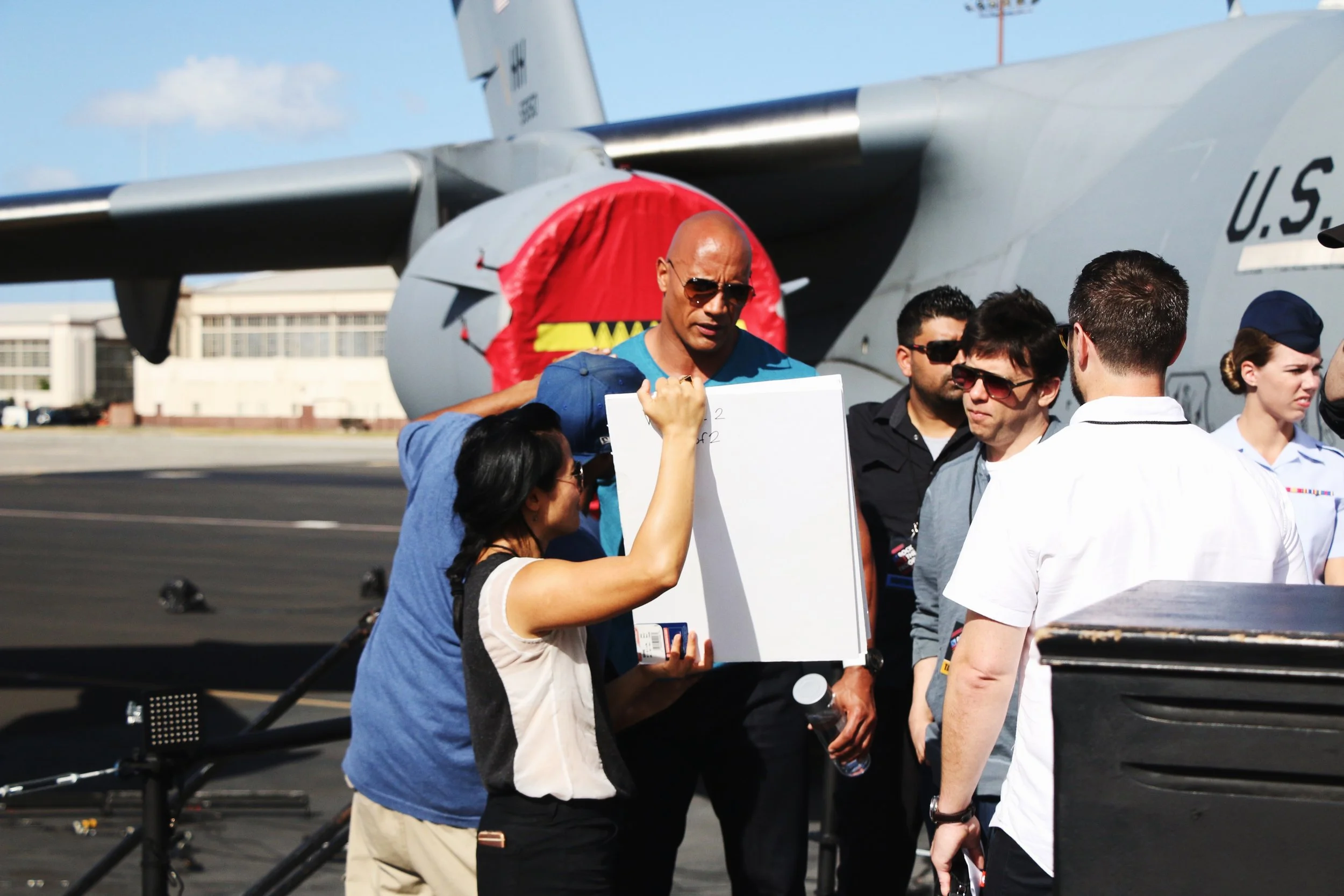 Behind the scenes of Rock the Troops. Dwayne 'The Rock' Johnson reading cue cards. Photo by Lisa Kholostenko.