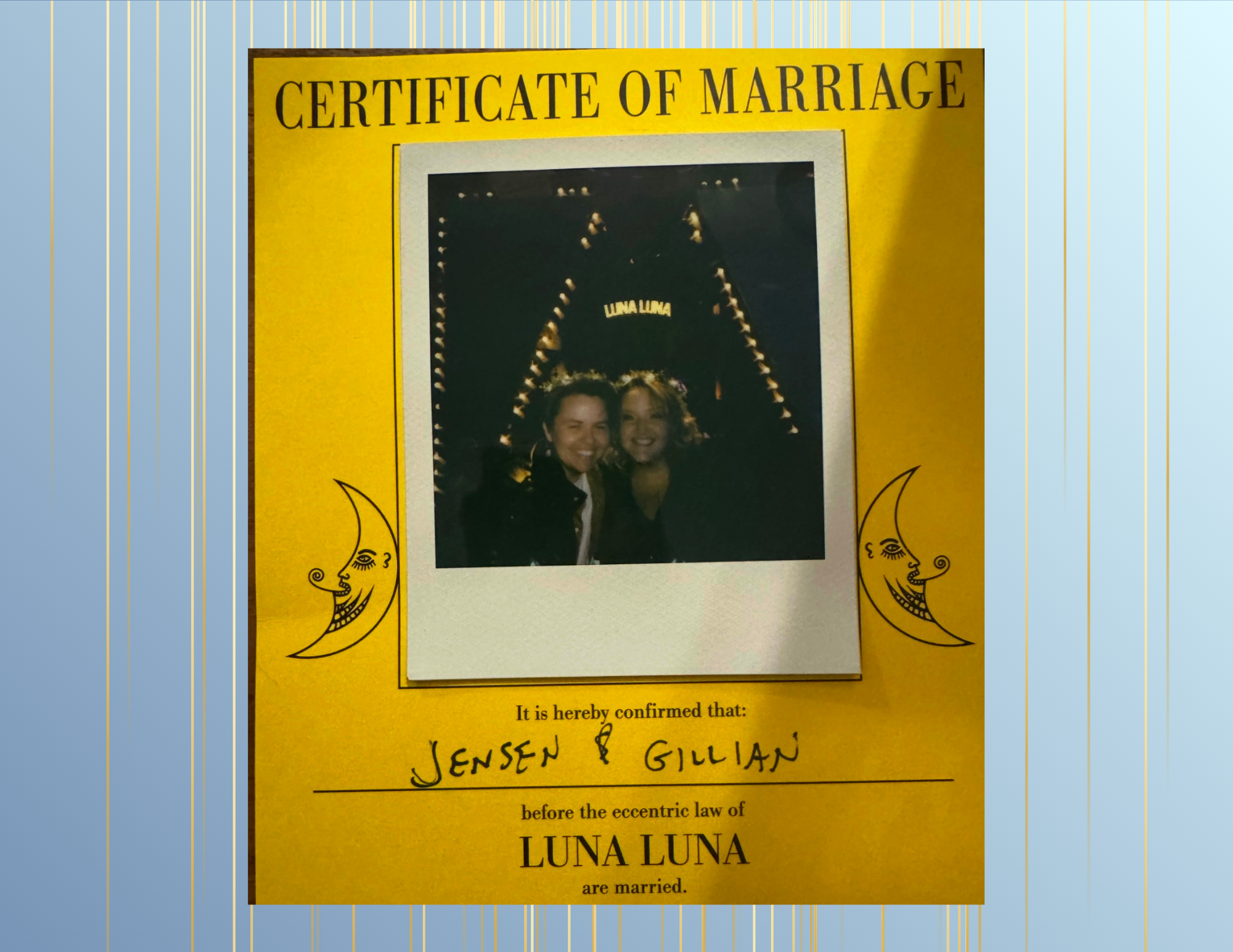 Yellow marriage certificate with a photo of a smiling couple in front of a lit-up arch at Luna Luna amusement park. The certificate confirms Jensen and Gillian are married.