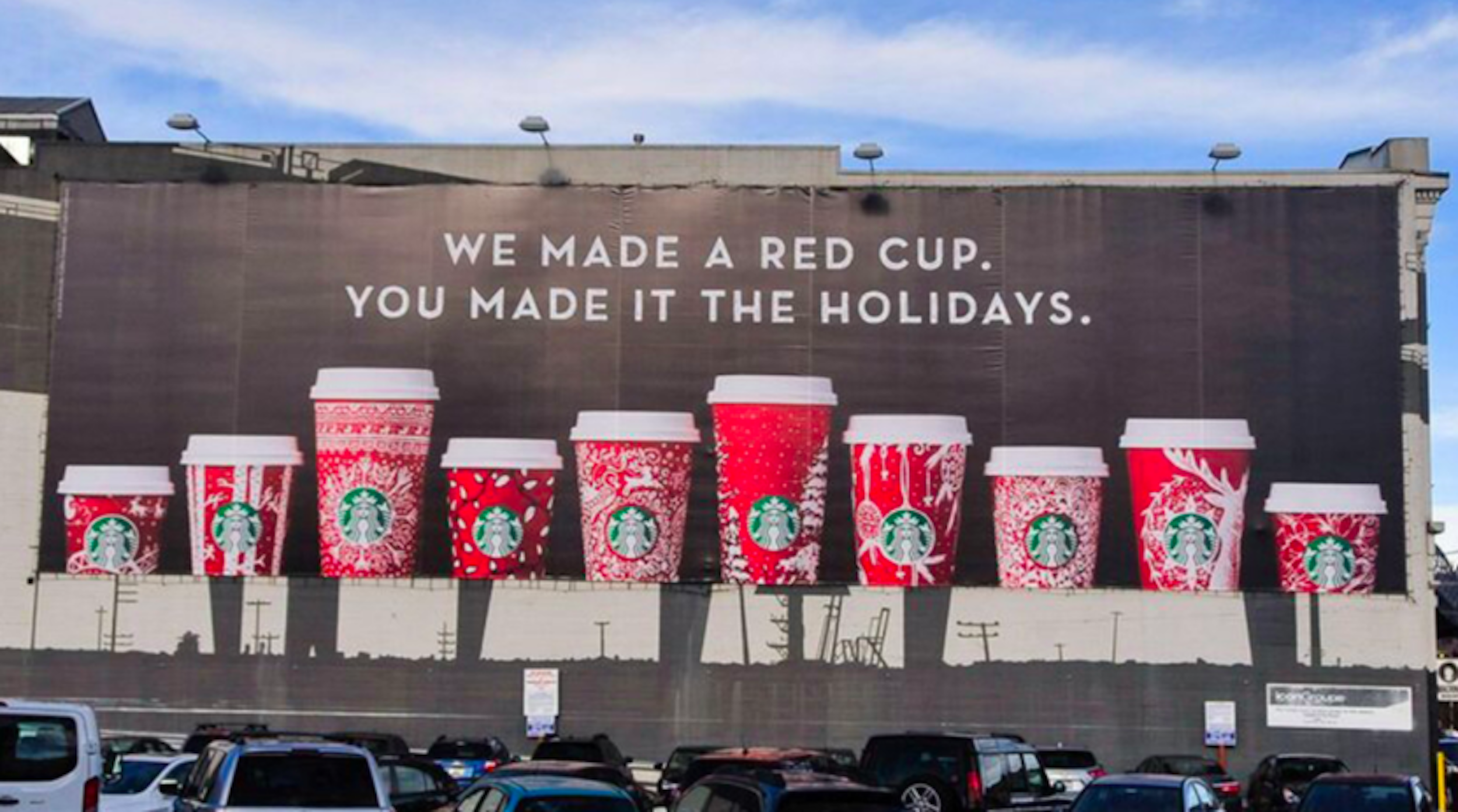 Billboard featuring Starbucks holiday cups with the message: "We made a red cup. You made it the holidays." Advertising. Producer. Miranda Kendrick.