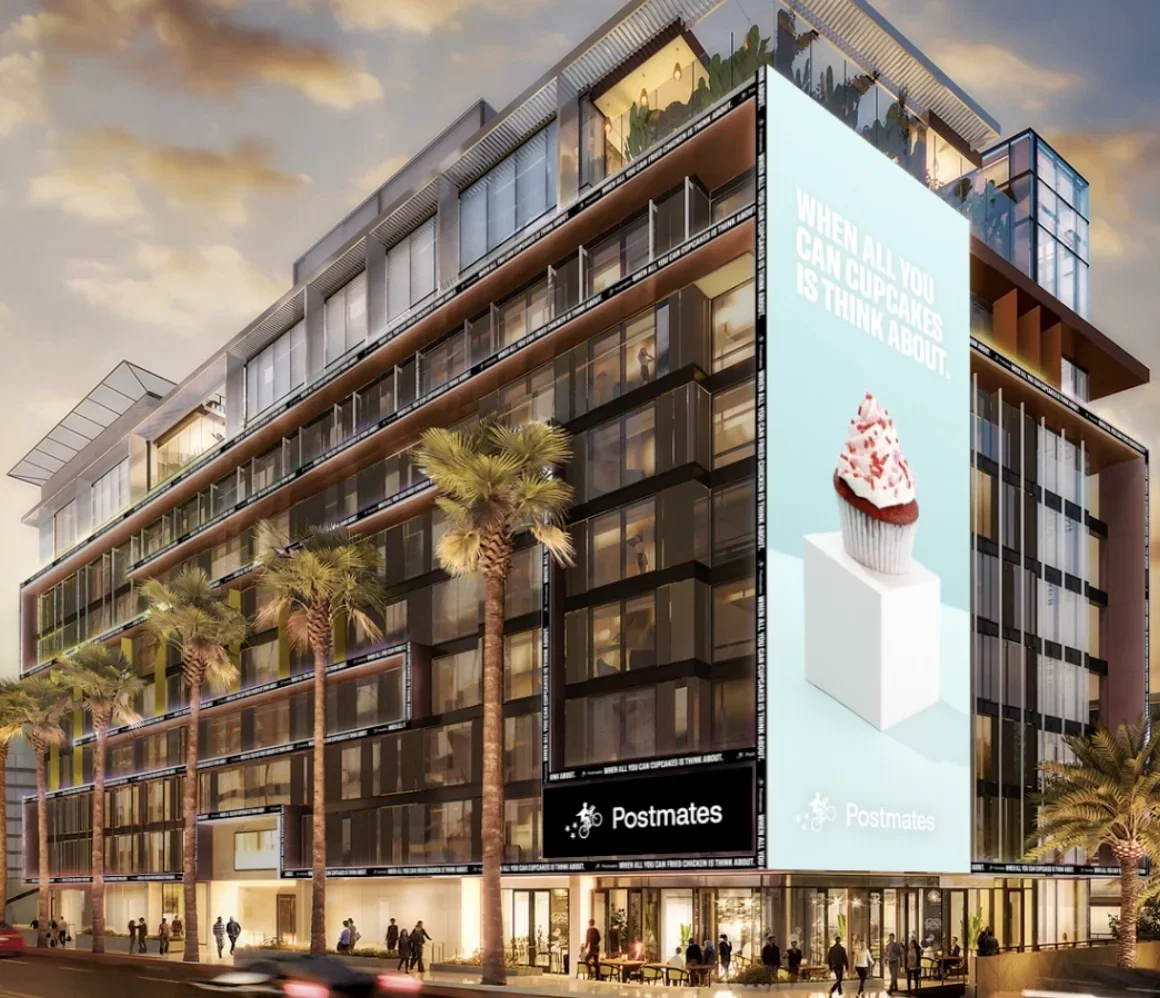 Billboard displays a cupcake with pink frosting and sprinkles, along with the text "When all you can think about is cupcakes." Postmates. Advertising. Producer. Miranda Kendrick.