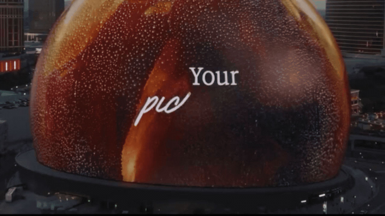 A large digital billboard displays with a space-themed background and the words "Your pic" written in white text.