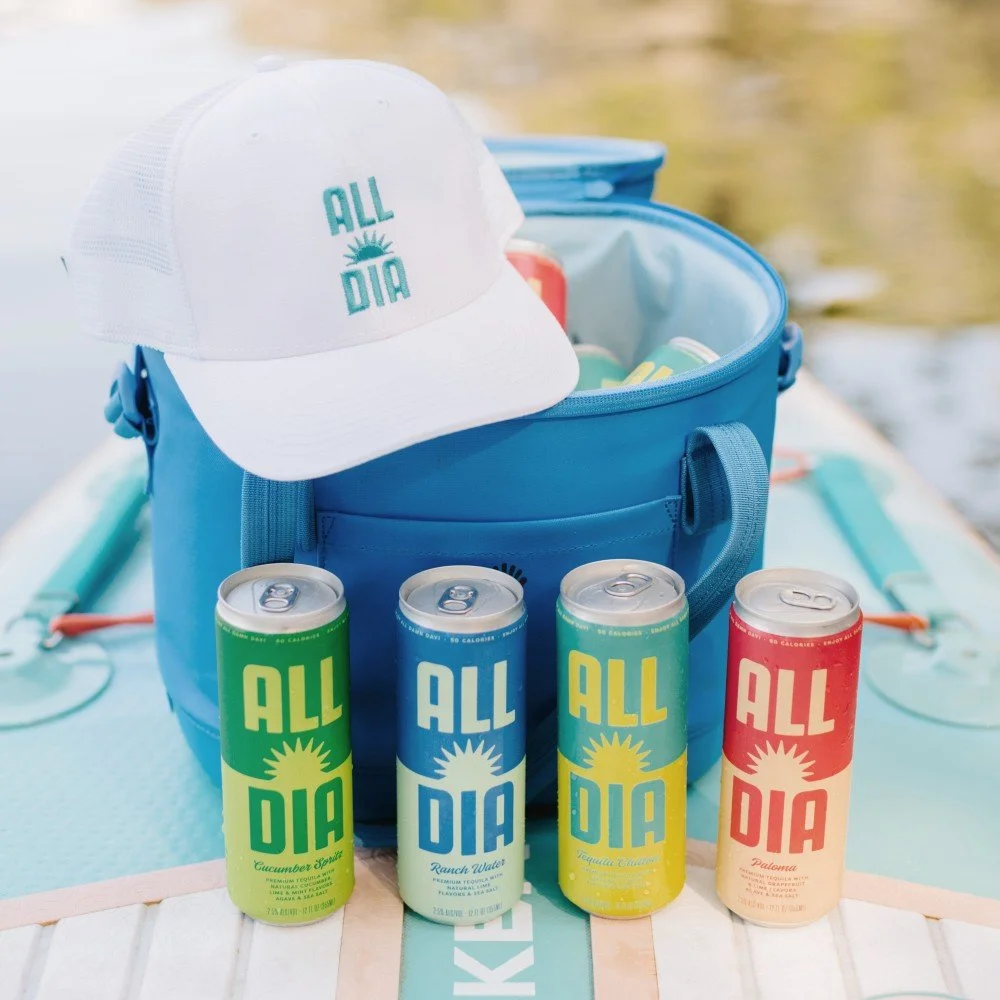 All Día cans and cap in a cooler