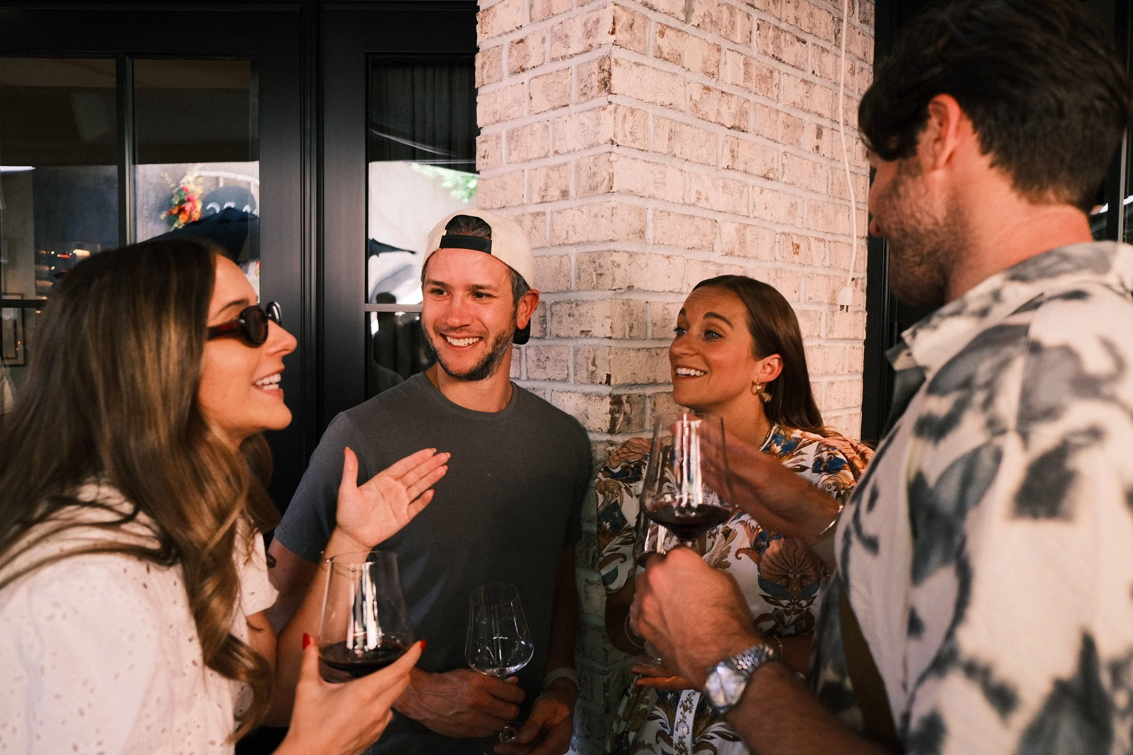 Camille Carlin, Founder of The CC Appetite, speaking with guests at the 43rd Annual Aspen Food & Wine Classic PARC Aspen Patio Party.