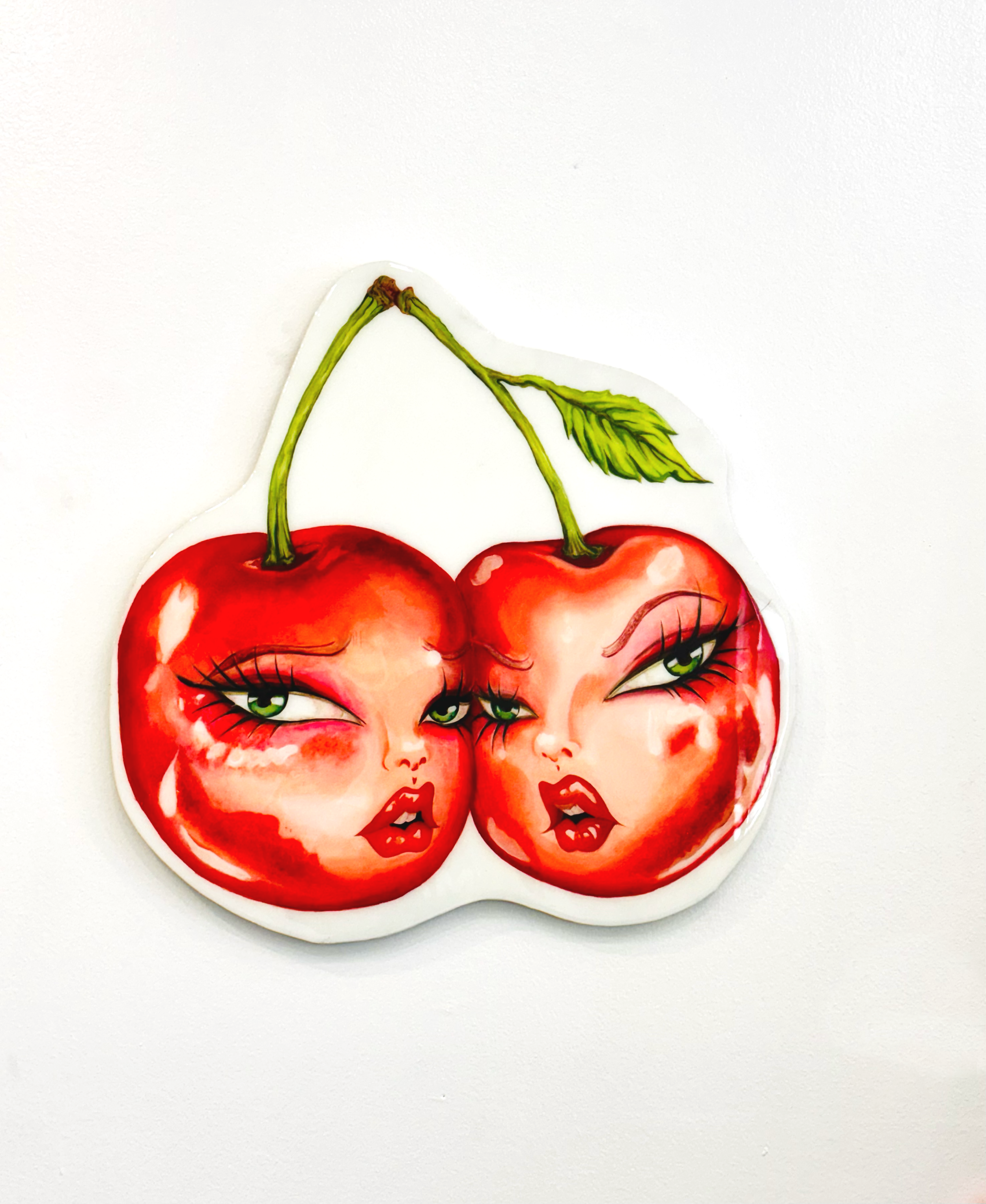 “We know what you did.”

Taylor Venturini and Tracey Springford 
Disappointed Fruit (Cherries)
 2026
 painted wood cutout
 dimensions 2’4” x 24.5”

$800
