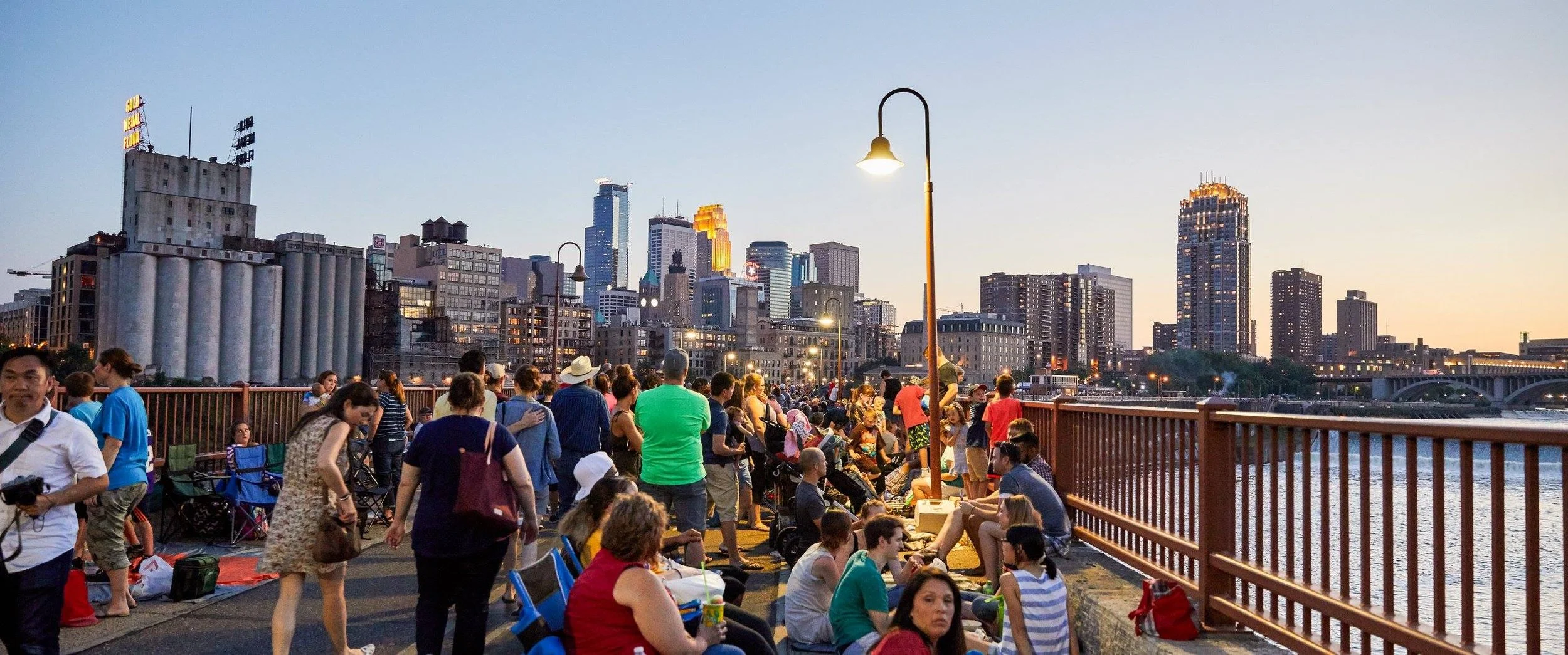 Stone Arch Bridge Aquatennial event scene featuring Minneapolis waterfront festival production and city event management