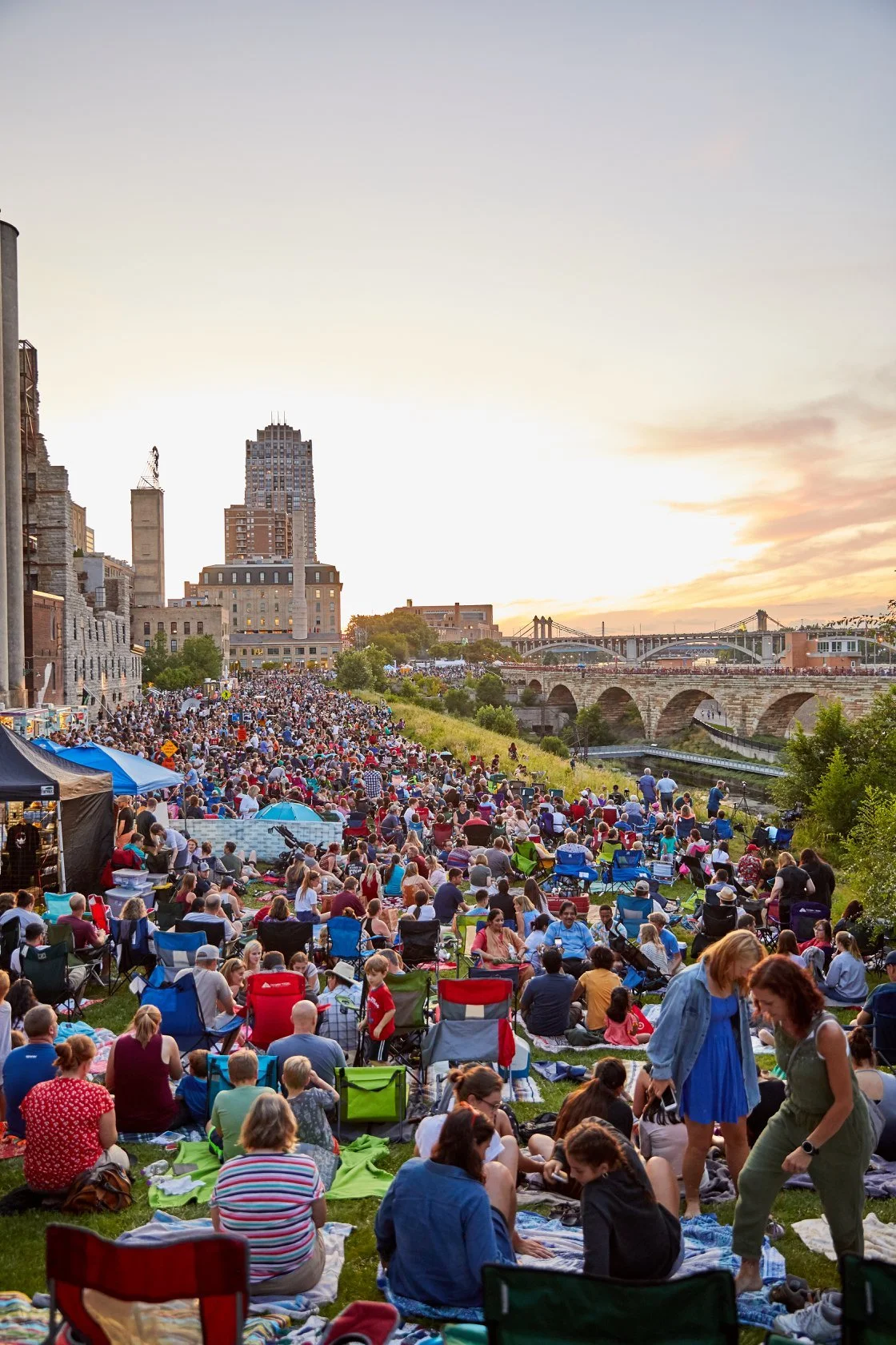 Large Minneapolis festival crowd featuring live entertainment, city event coordination, and public event production