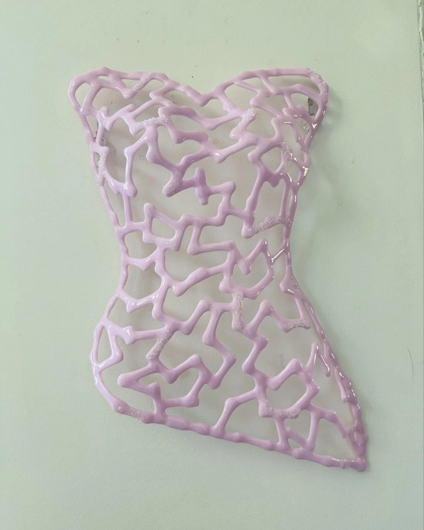 Introducing my latest work, &ldquo;The Power She Holds.&rdquo; This piece is a sculptural torso made of fused glass in a beautiful pink, lace-like pattern. Its open design gives it an airy, delicate look. Inspired by the strength and elegance of wome