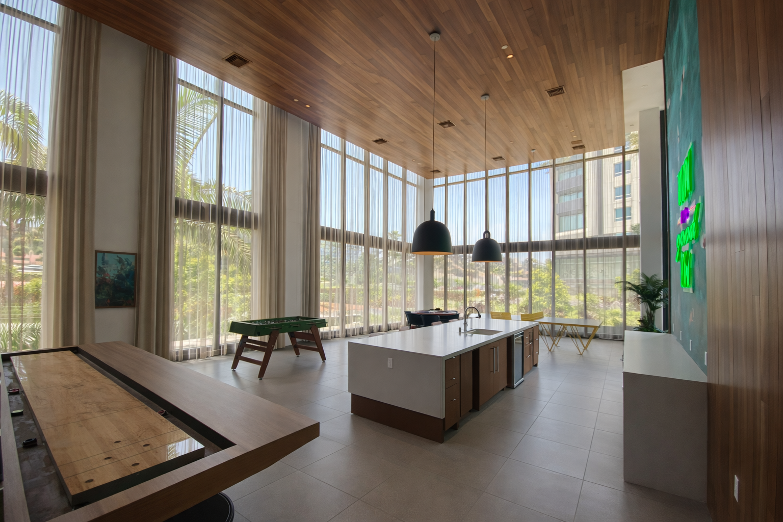 Custom floor-to-ceiling sheer drapery installation for modern commercial space with expansive glass walls and natural light in San Diego