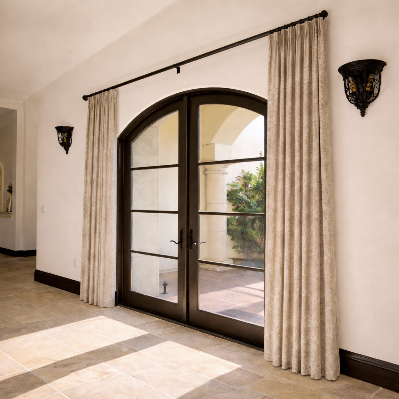 Custom drapery for arched French doors in San Diego home