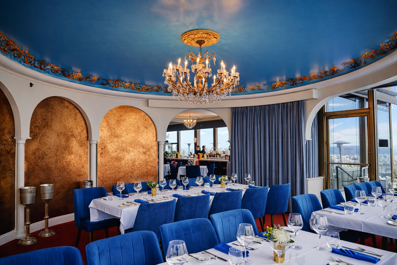 Custom commercial drapery installation for Mister A’s restaurant in San Diego featuring curved track system and tailored panels in upscale dining space