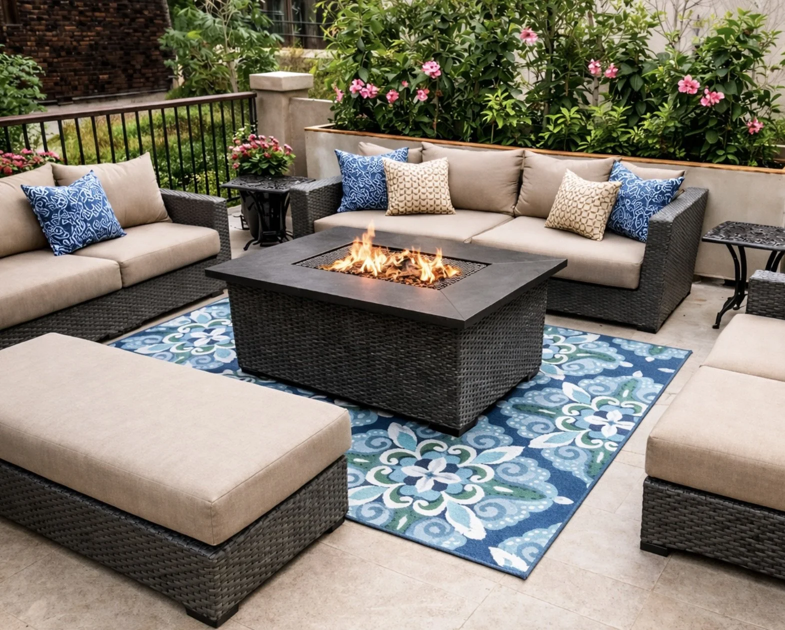 Custom upholstered outdoor seating with neutral cushions and accent pillows around a fire pit in San Diego patio