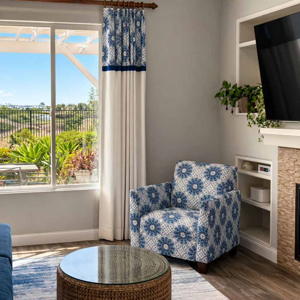 Custom upholstered accent chair with blue patterned fabric in San Diego home