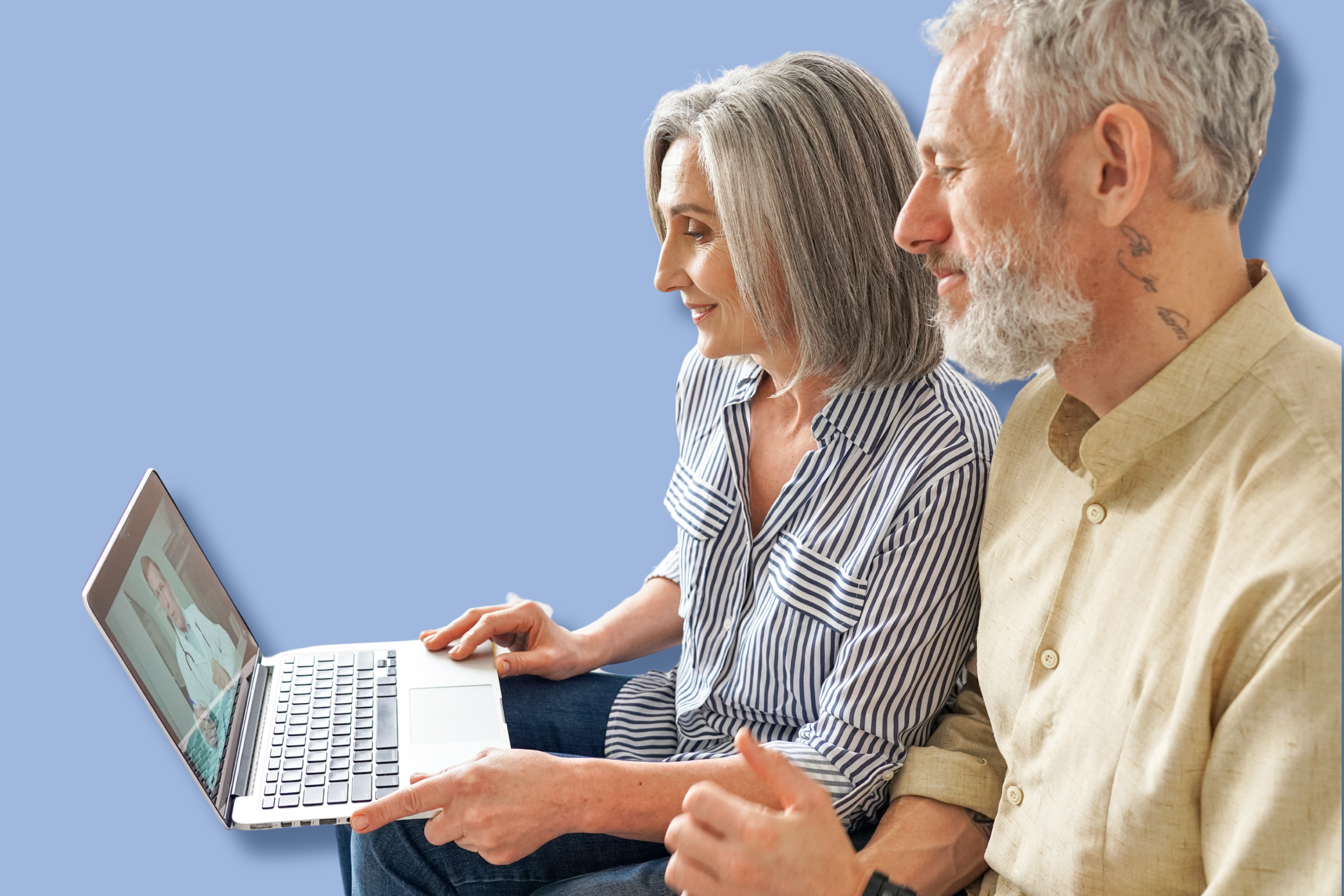 A middle-aged woman and man sitting side by side, having a video call on a laptop, with the woman using the laptop and the man gesturing with his hand, both smiling and looking at the screen, against a plain blue background.