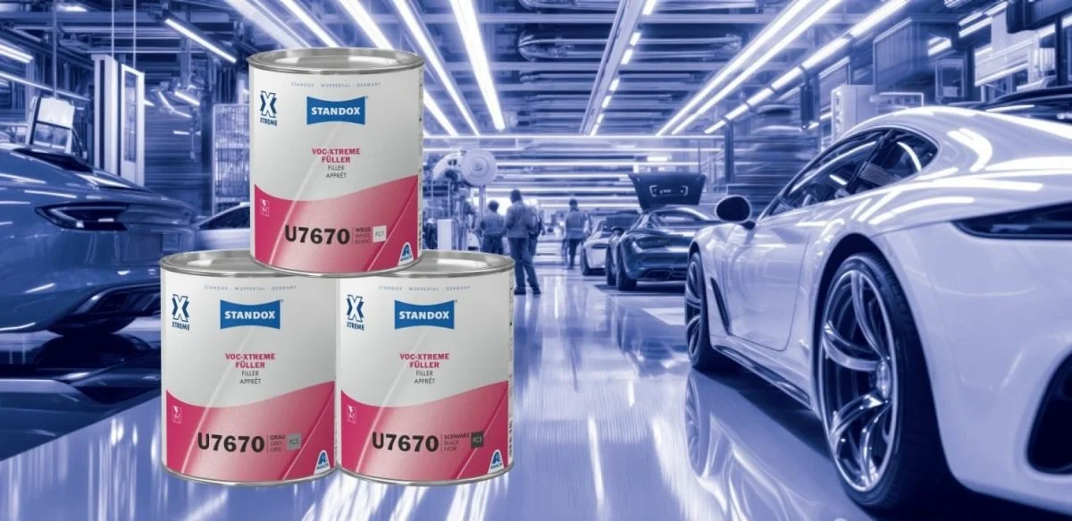 Three cans of STANDOX VOC-XTREME filler in an industrial setting with luxury sports cars and workers in the background.