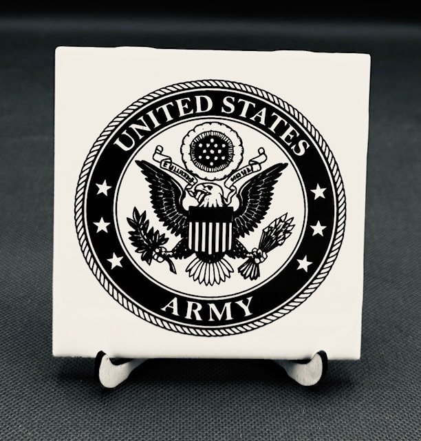 White plaque engraved  Black and white United States Army emblem on a small display stand.