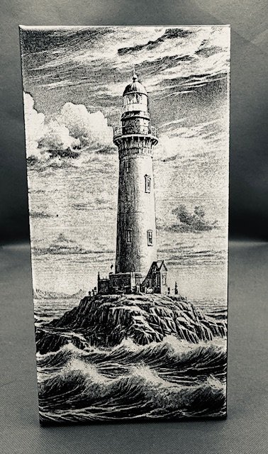 Black and white illustration of a lighthouse on a rocky island surrounded by turbulent ocean waves under a cloudy sky.