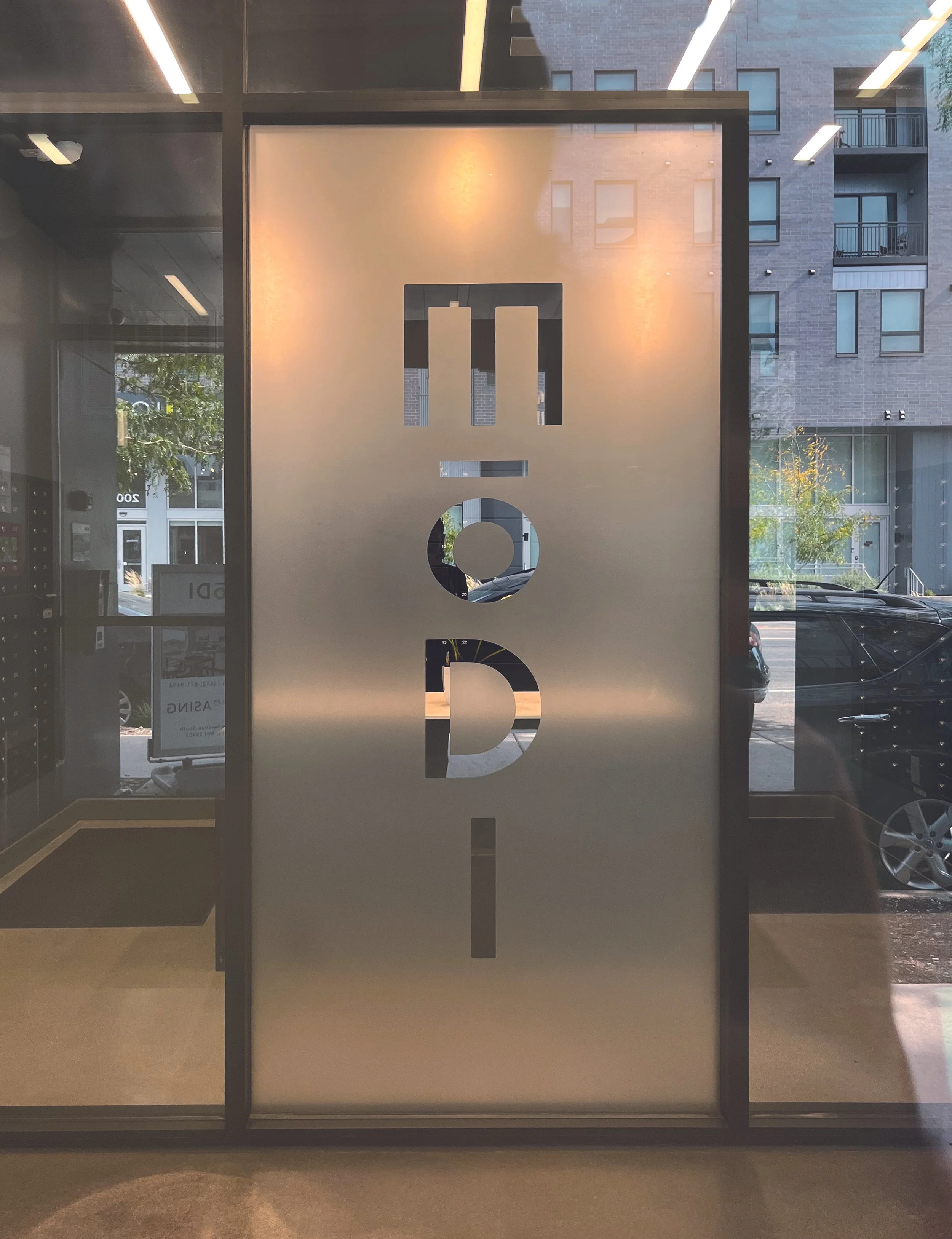 Modi Apartments exterior building signage