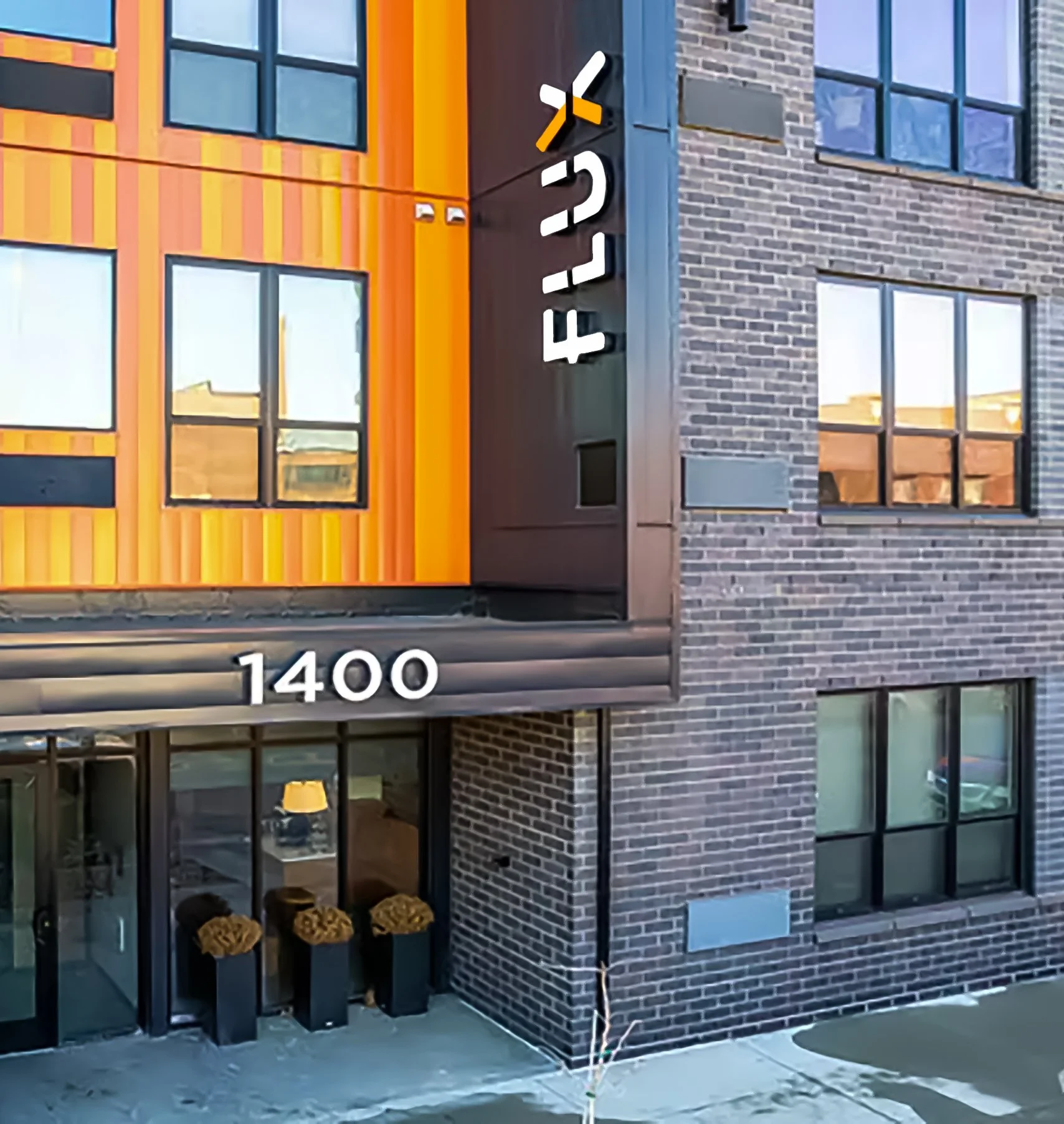 Flux Apartments exterior building signage